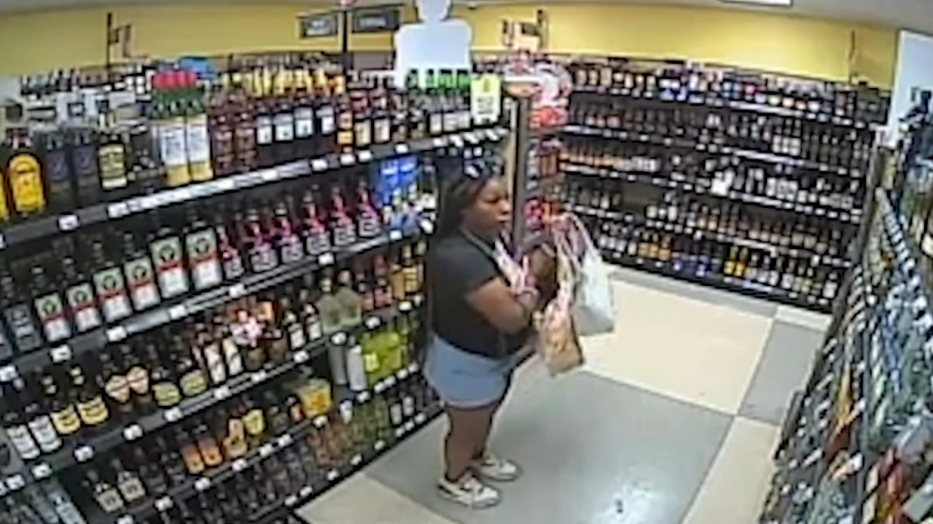 Video provided by the Blendon Township Police Department shows Ta'kiya Young allegedly stealing bottles of alcohol minutes before being fatally shot by police.