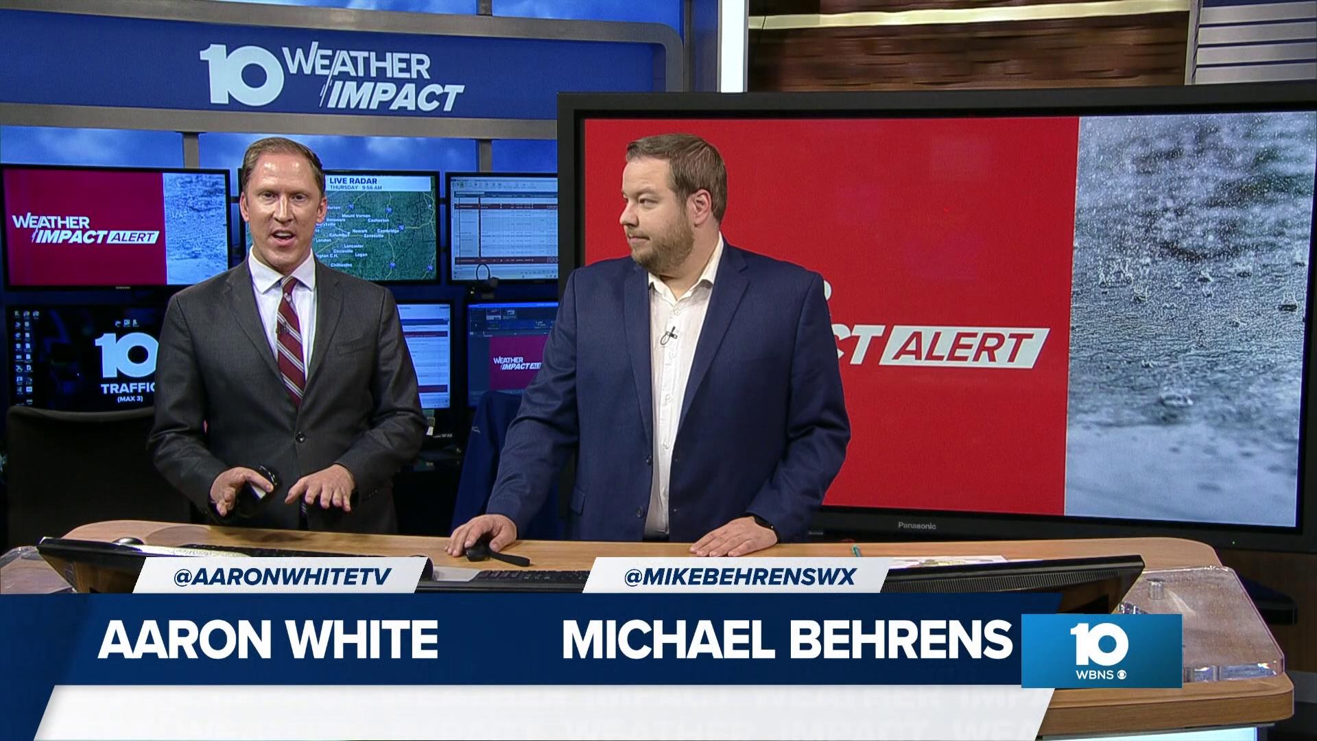 Meteorologists Michael Behrens and Aaron White track the rain expected to arrive on Friday.