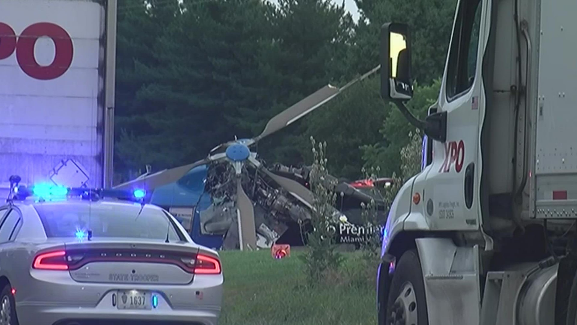 Authorities say a medical helicopter responding to the scene of a fatal accident in southwestern Ohio crashed when it hit power lines.