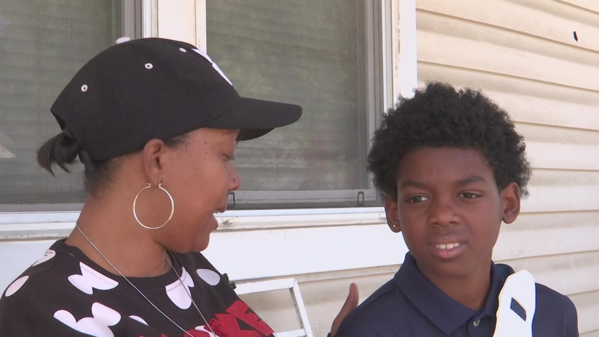 The mother of the 10-year-old boy injured in the shooting said their home was hit with at least 30 bullets early Saturday morning.