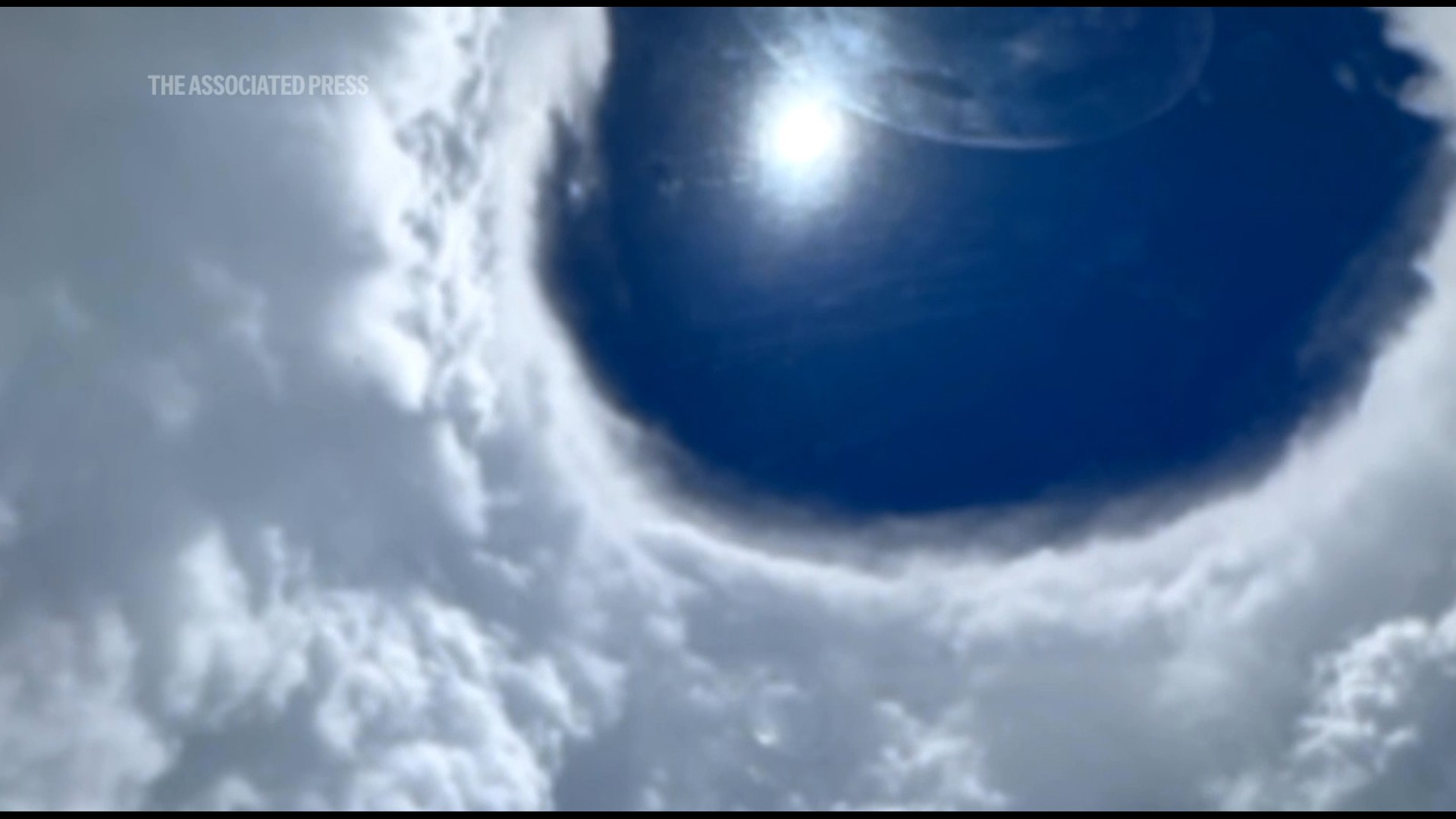The U.S. Air Force 403rd Wing released video showing one of its planes entering the eye of Hurricane Erin. Video from NOAA also showed a plane inside the eye.