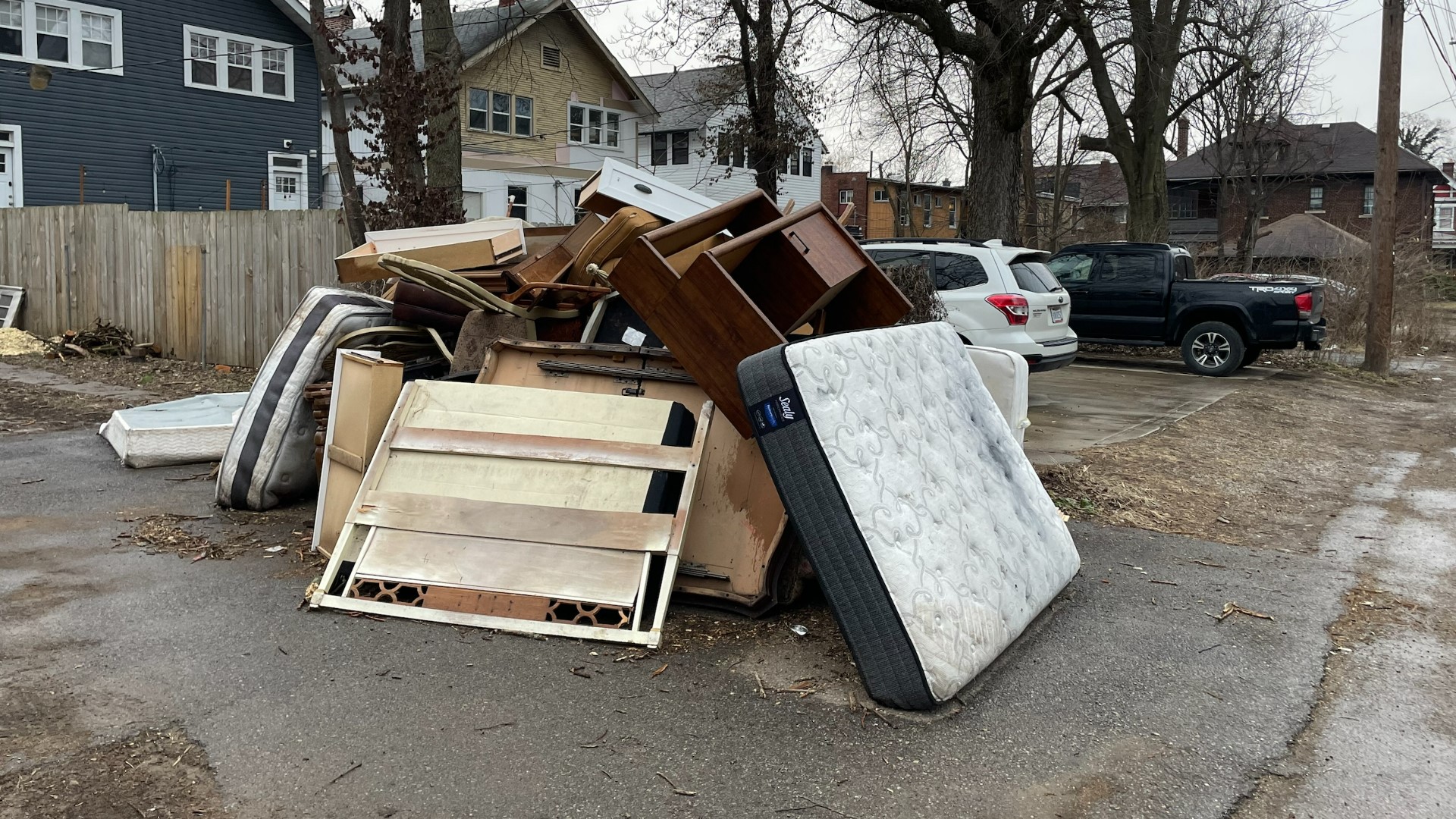 Residents say a dumping pile has been building up behind a property on Oak Street for nearly two months.