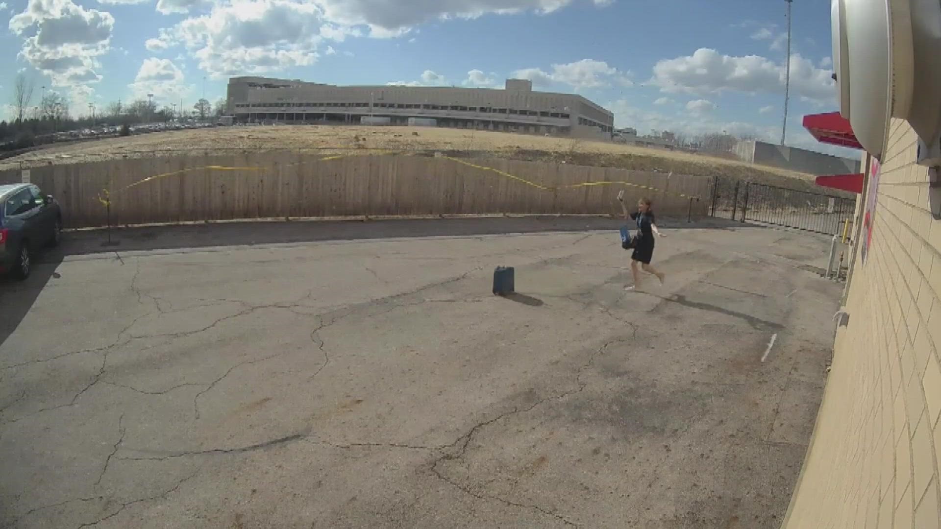 It was windy in central Ohio on Thursday and our security cameras caught Yolanda chasing down her suitcase on her way into work!