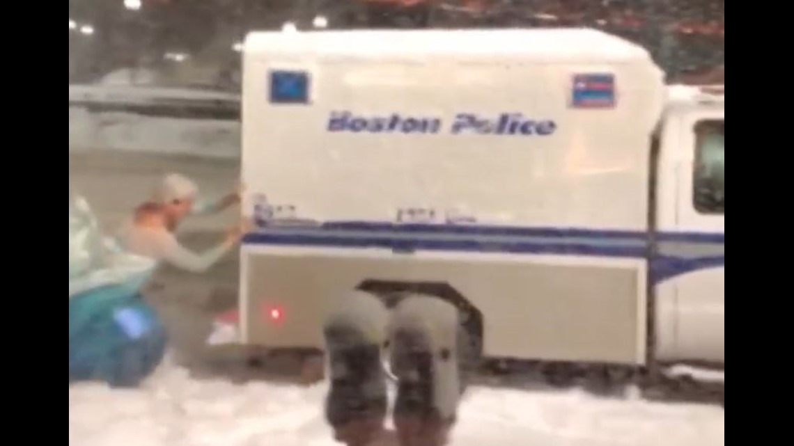 Man Dressed As Elsa From Frozen Pushes Police Wagon From Snow
