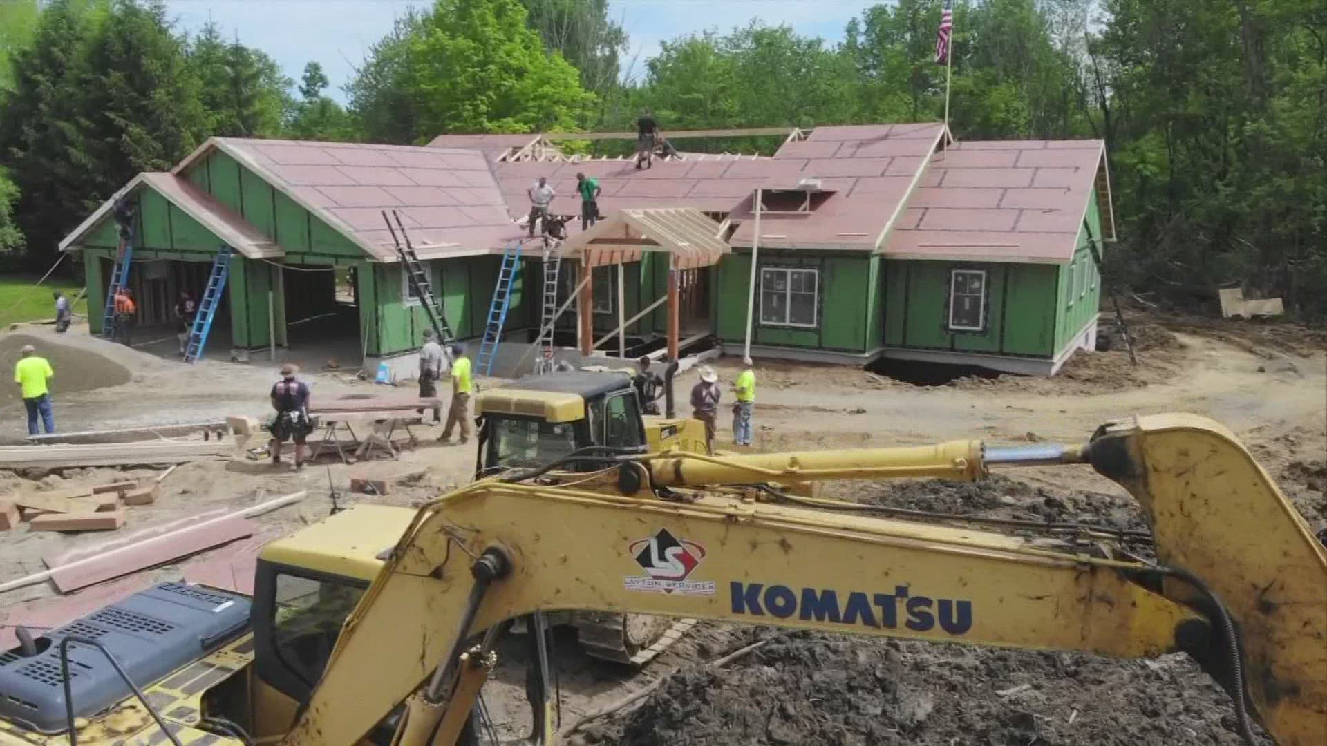 More than 100 firefighters from 14 states are pitching in to build the home in just about two weeks.