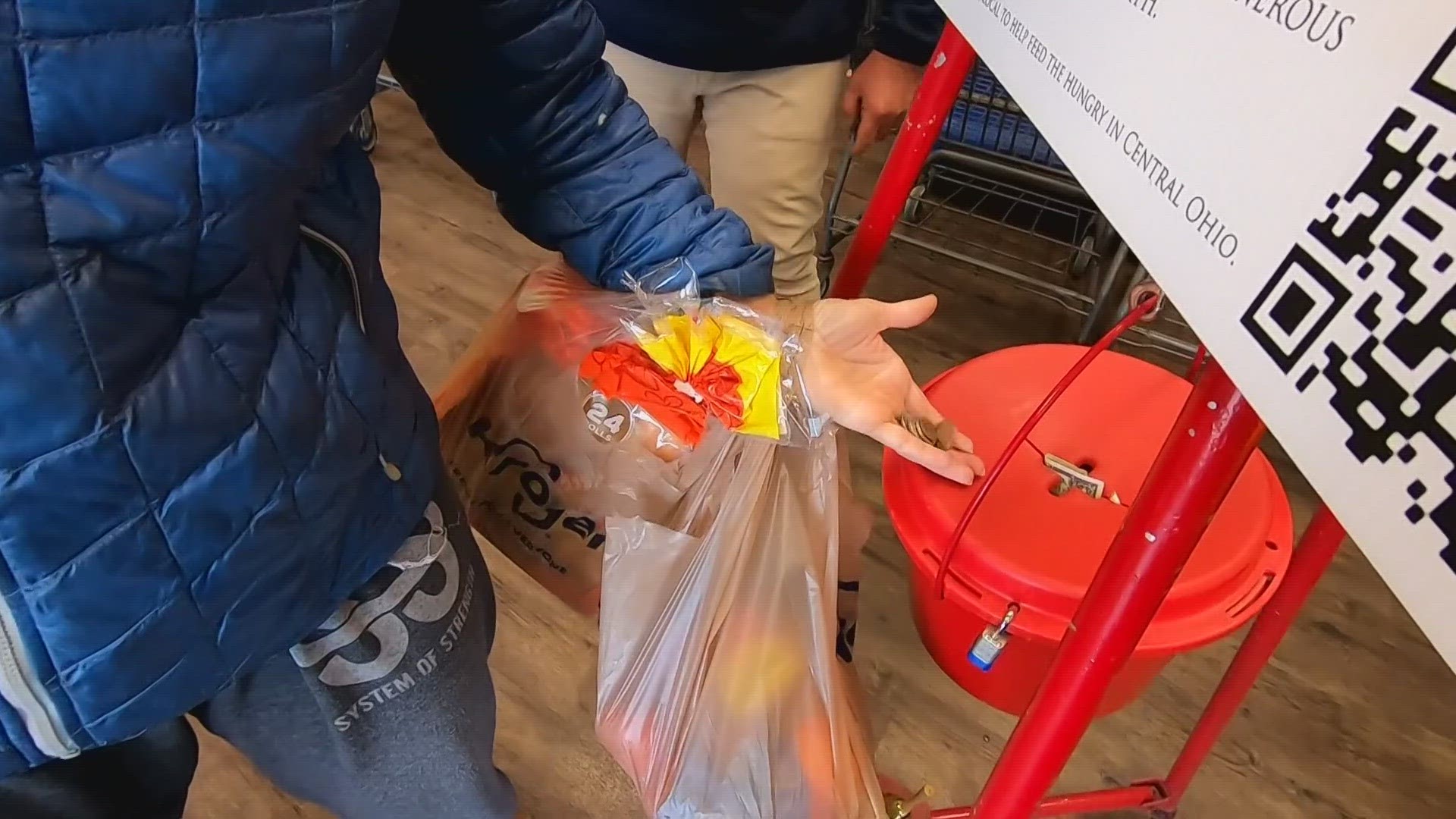 The Salvation Army's red kettle bells ring outside Kroger this holiday  season