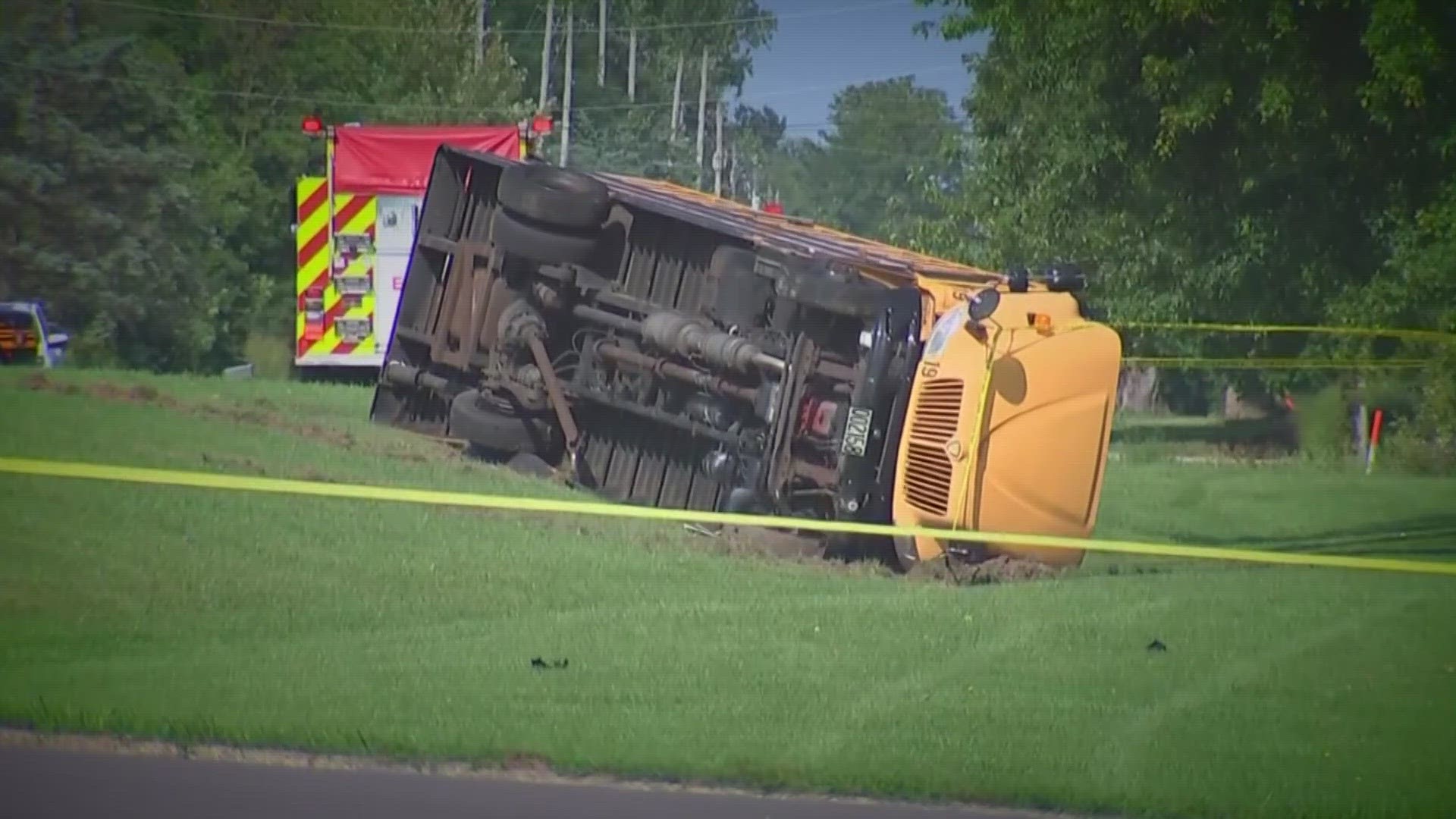 A school bus full of children overturned after a crash with a minivan in Clark County, killing one child and injuring 23 others, one seriously, authorities said.