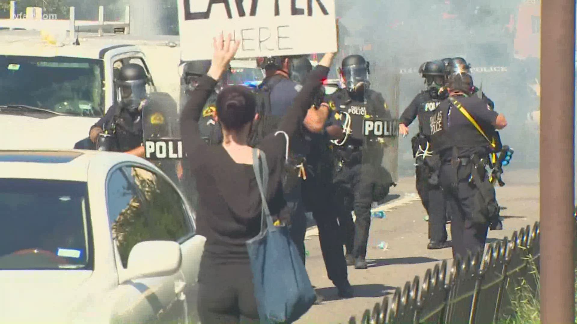 Protests that initially had been peaceful took a turn Saturday as protesters damaged several Dallas police squad cars and officers deployed "gas" and flash bangs