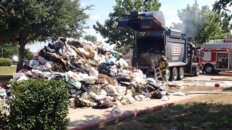 Garbage truck empties smoldering trash at North Texas fire station