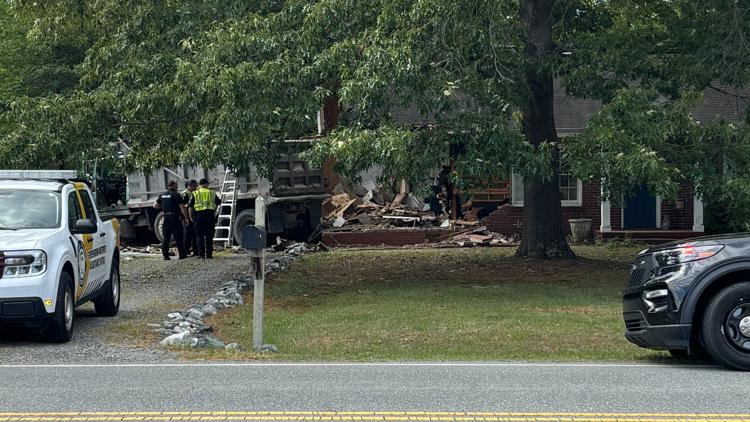 Dump truck crashes into Greensboro home, injuring two