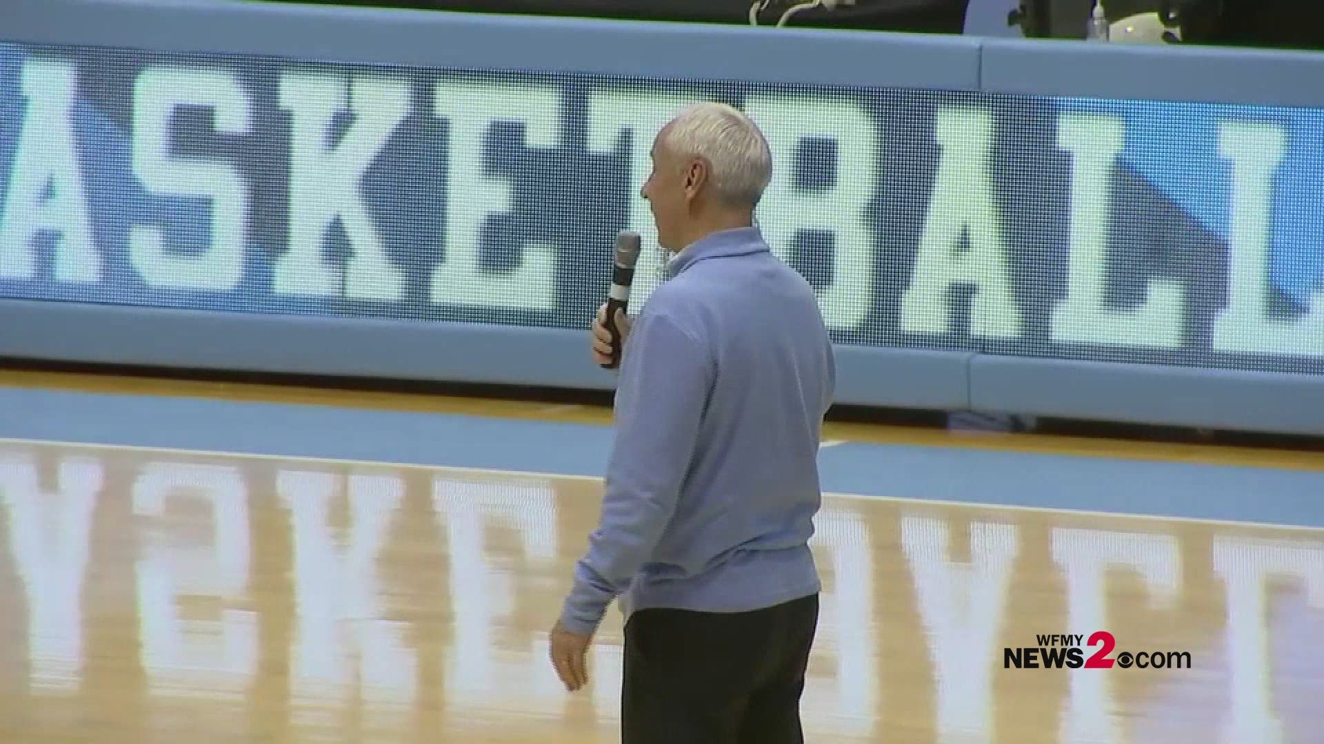 UNC coach Roy Williams kissing the Dean Dome floor after the Tar Heels final home game vs. Duke.