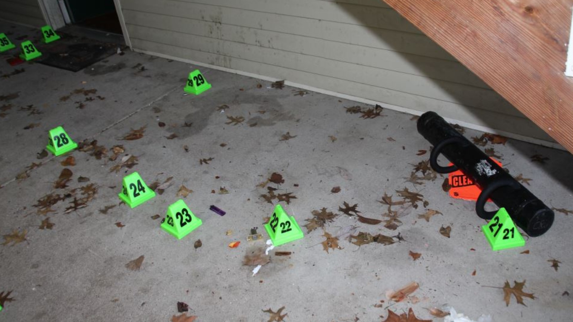 Photos show dozens of shell casings outside Taylor's apartment and bullet holes throughout every room.