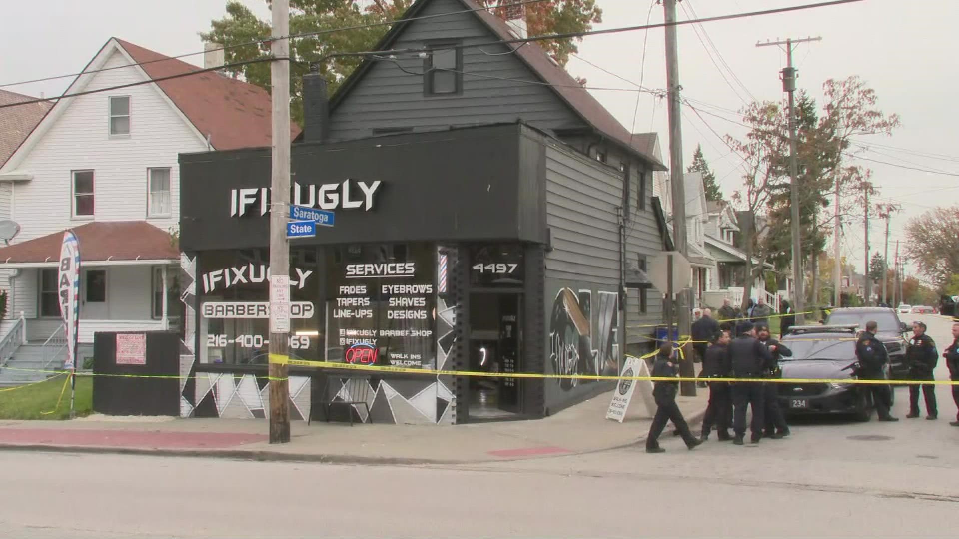 Police say a man entered the shop and began firing at people inside. The man then left in a red, four-door vehicle.