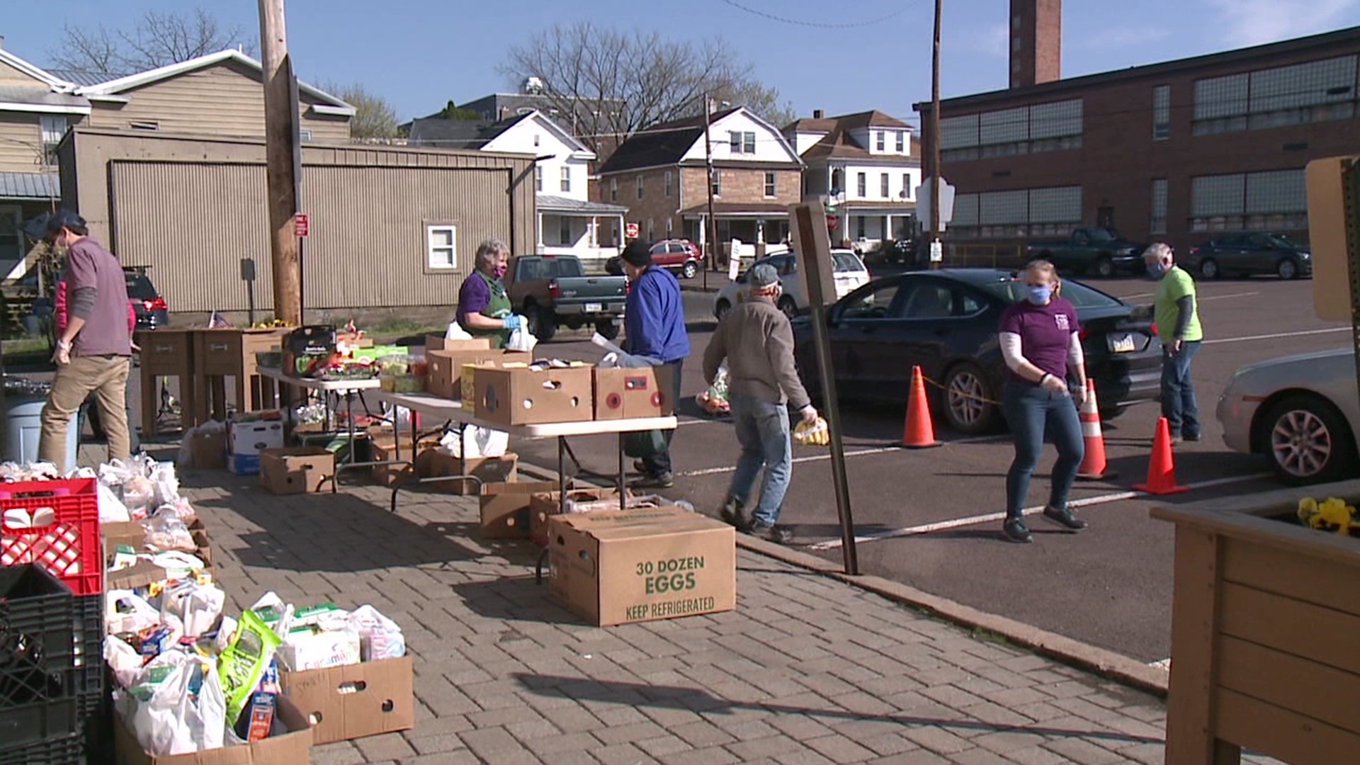 Volunteers at Bloomsburg Food Cupboard loaded up groceries into cars along Center Street.