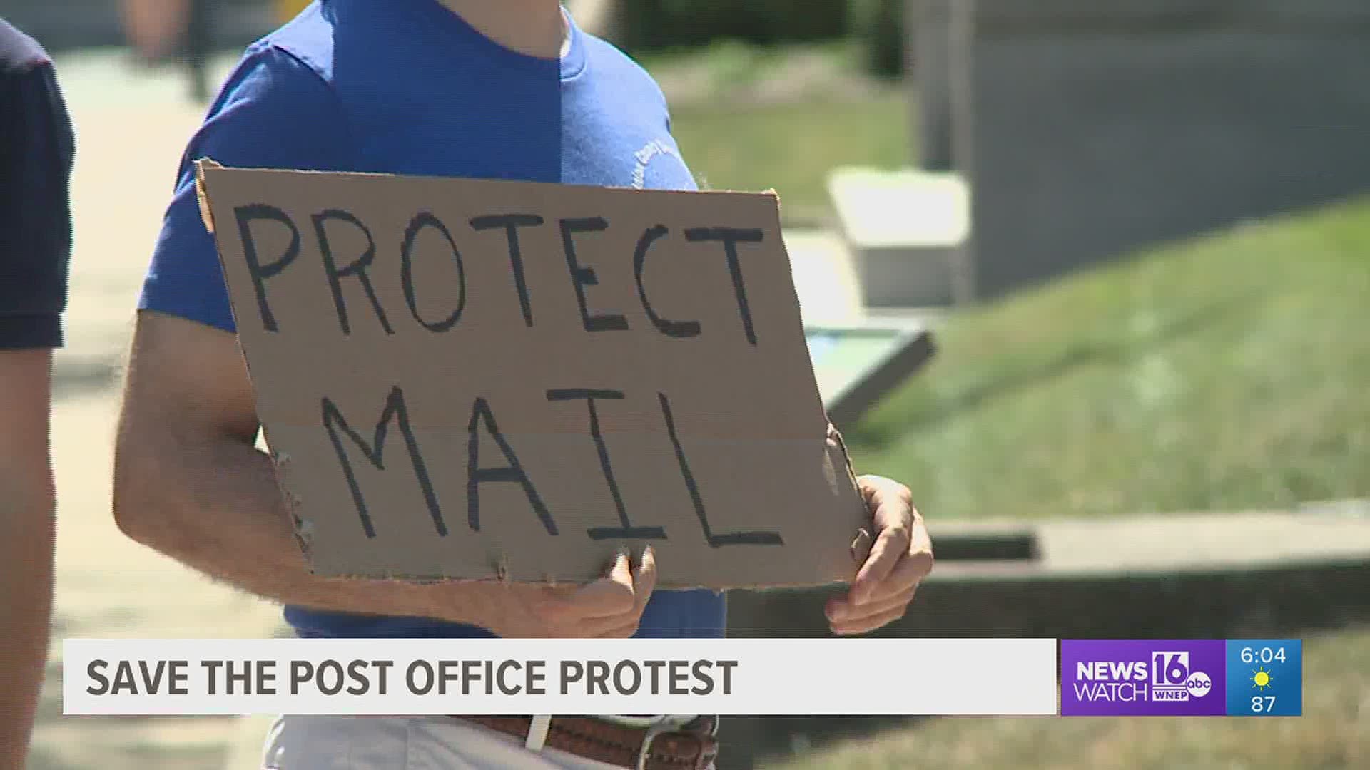 A group of protesters gathered at a post office in Lewisburg Saturday afternoon to show their support for the United States Postal Service.