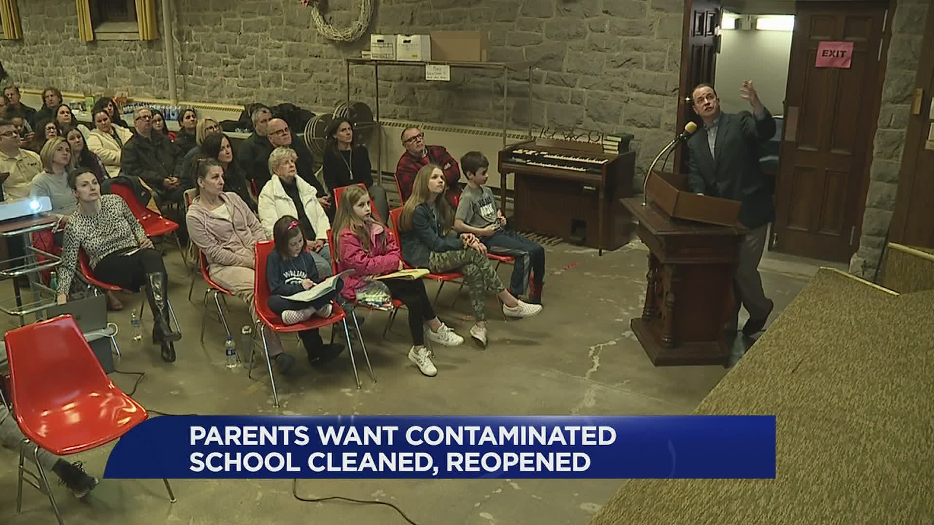 Parents gathered to discuss the asbestos and lead found in schools throughout the district.