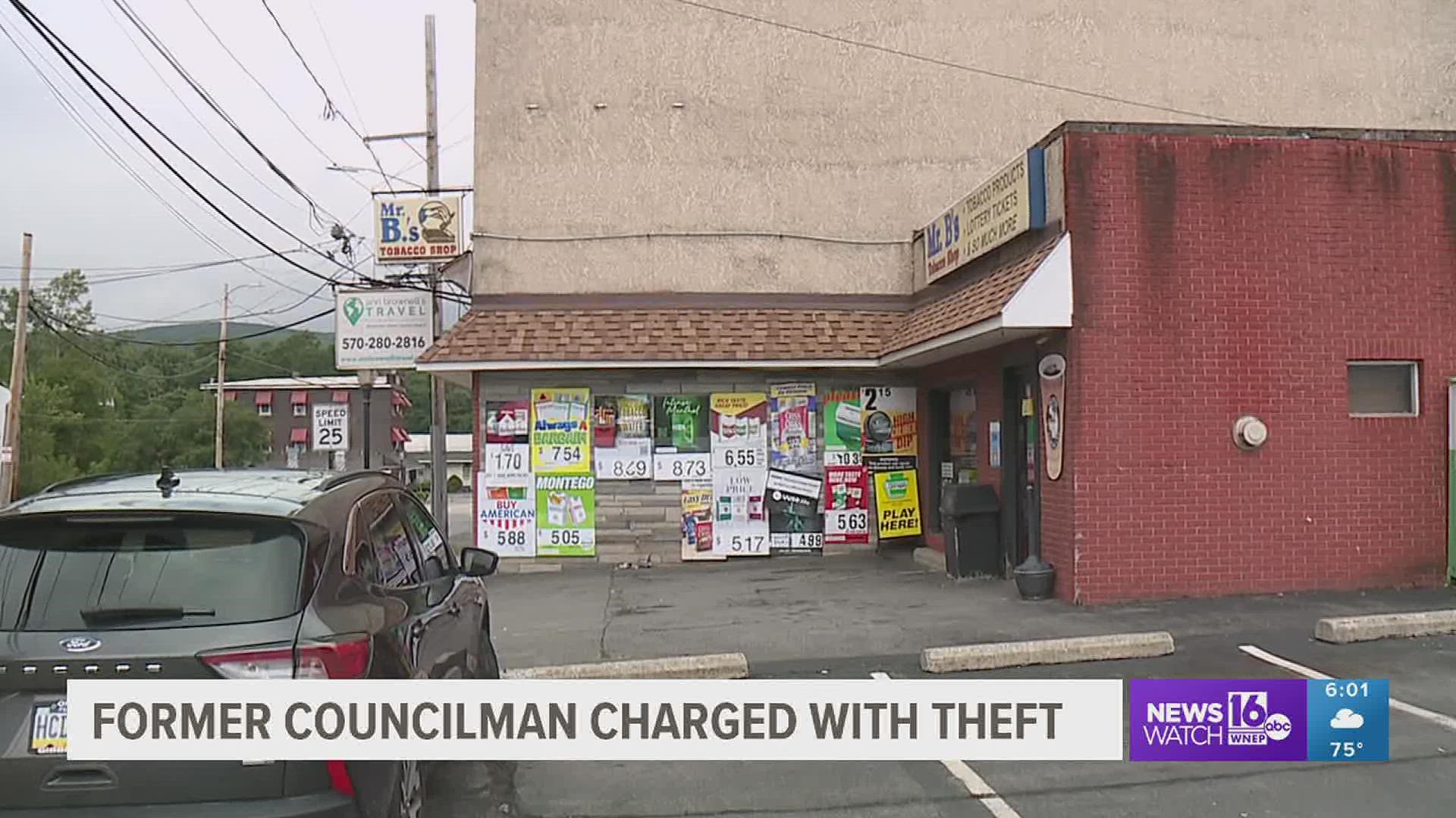 A former city councilman in Lackawanna County turned himself in Monday morning to face theft and forgery charges.