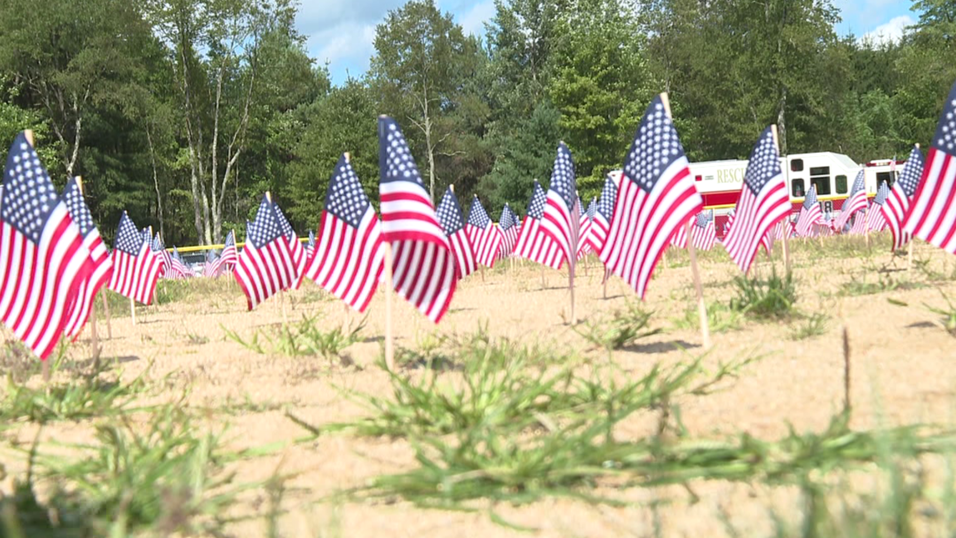 Nearly 3,000 flags line a baseball field, symbolizing every person lost in the 9/11 attacks.