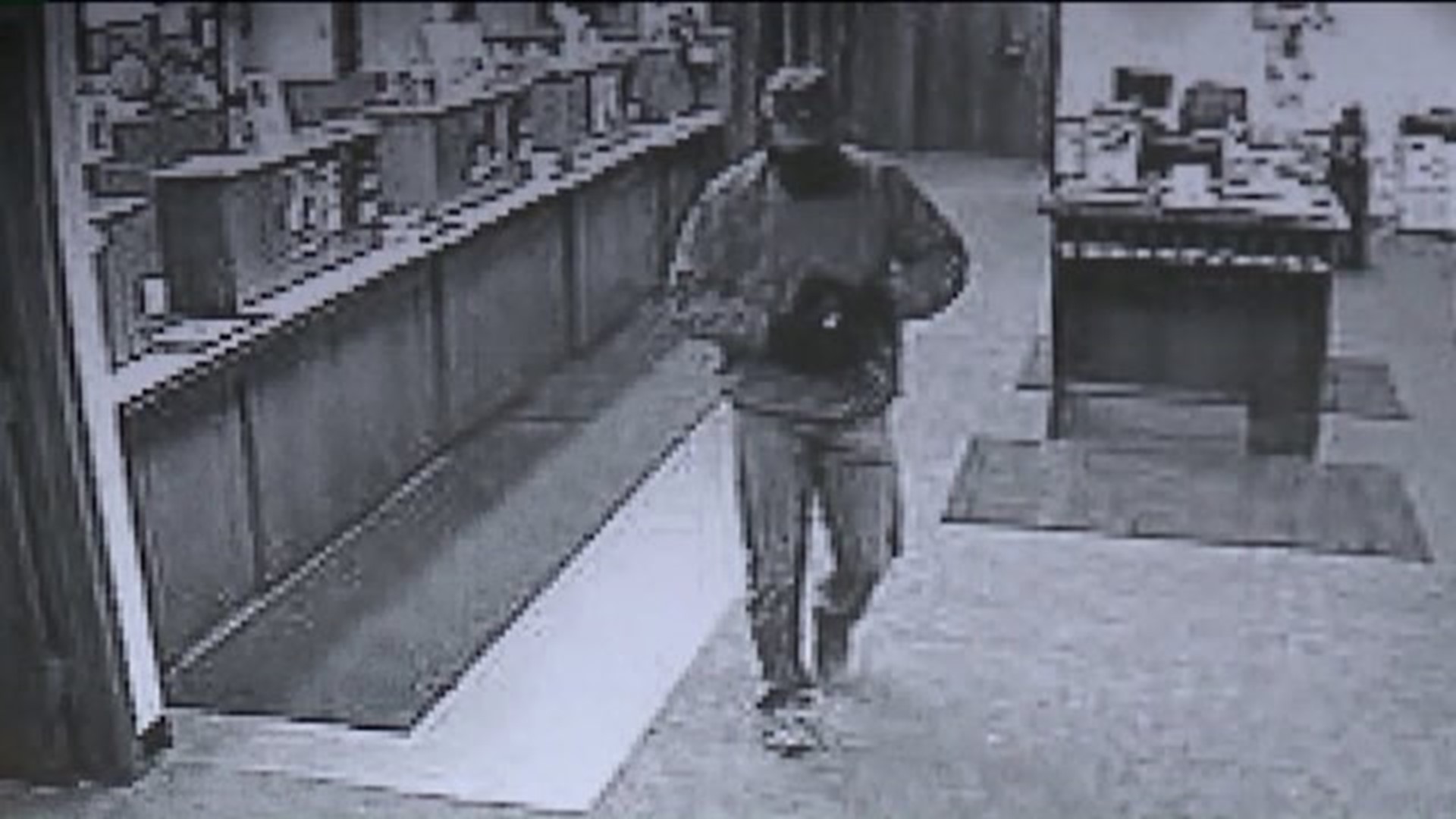 Bank Offers Reward for Robber`s Arrest