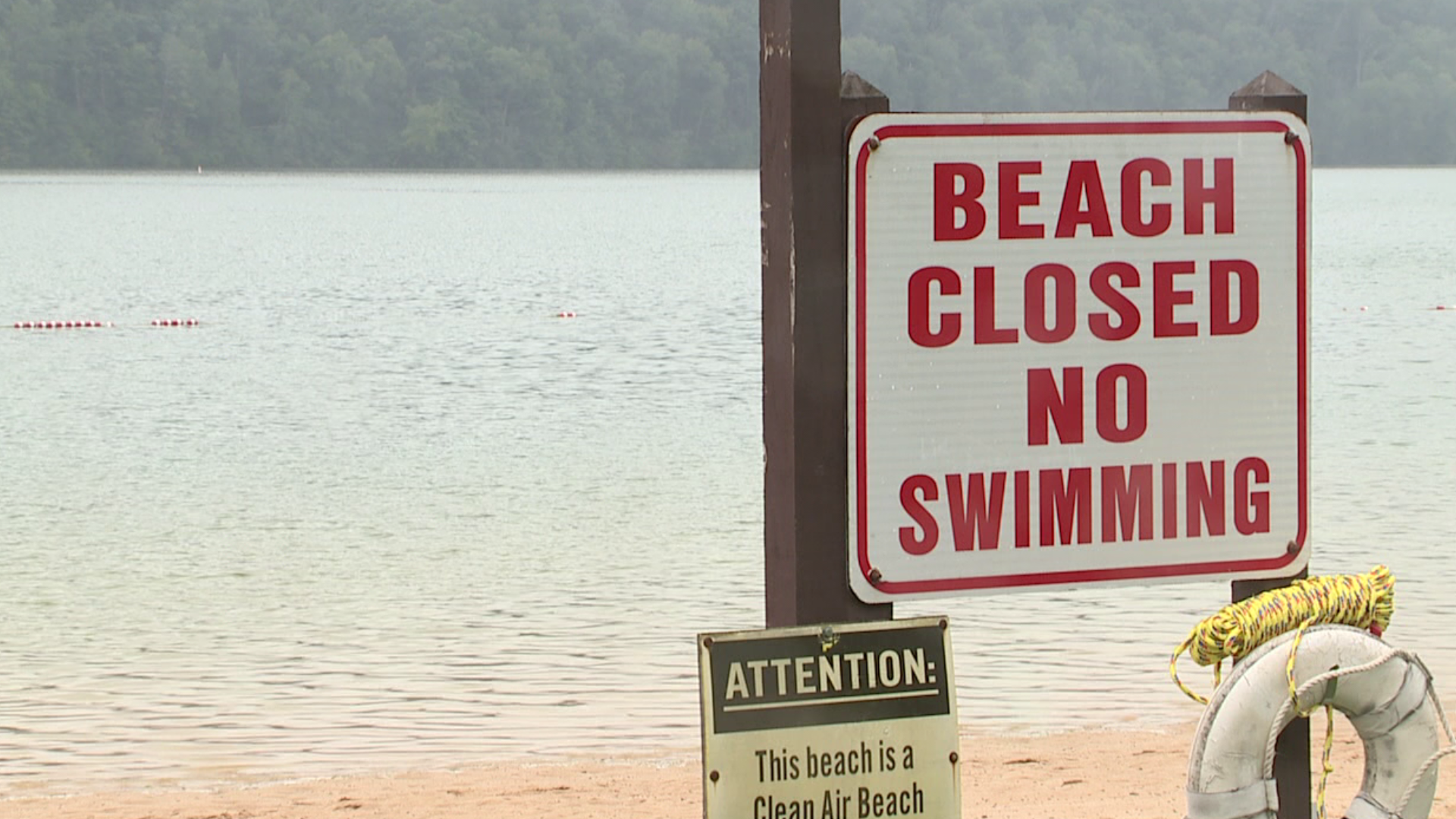 High waters and bacteria levels cut short a Labor Day last dip in the lake.