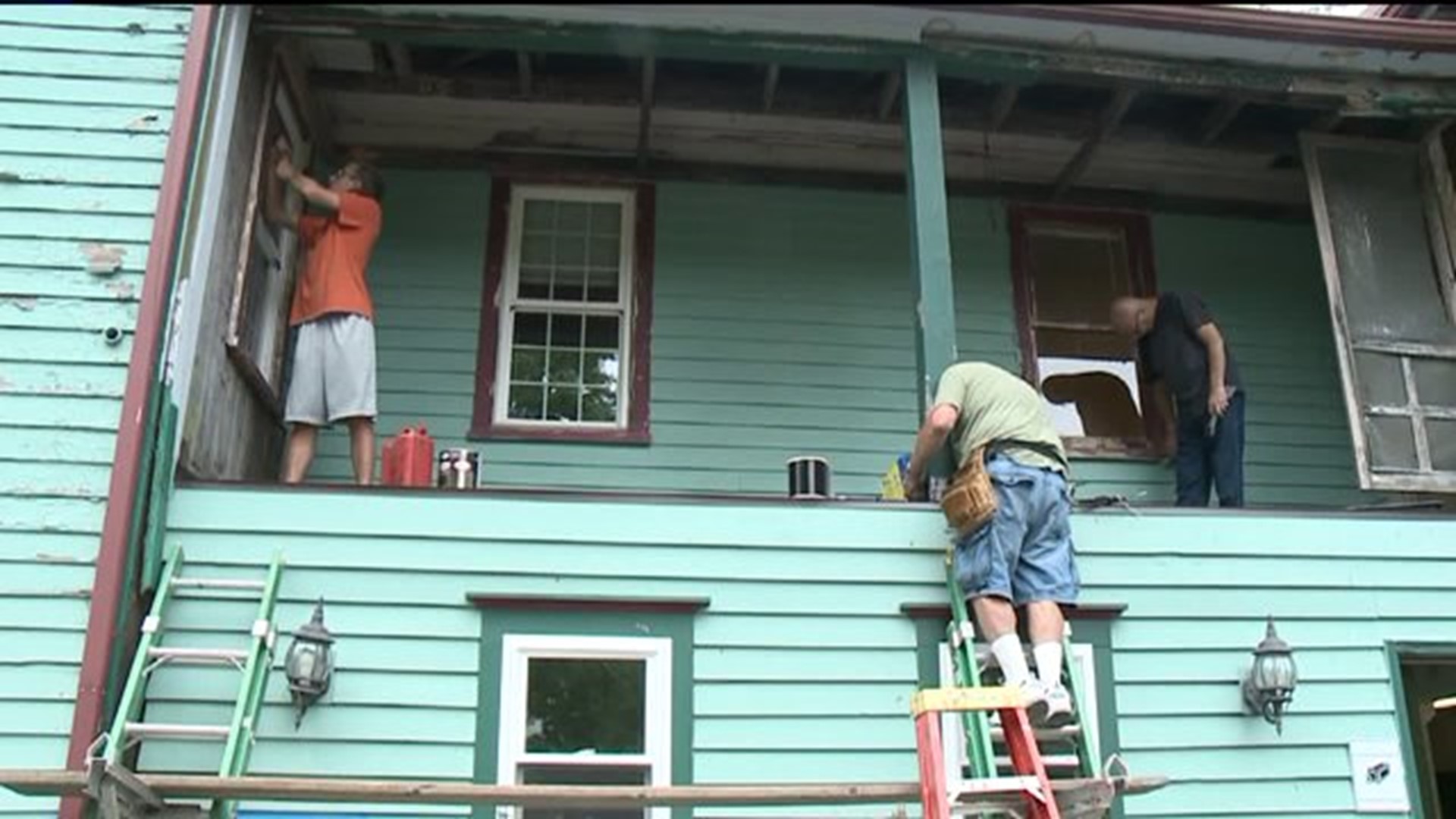 Volunteers Pitch In To Help Paul`s House