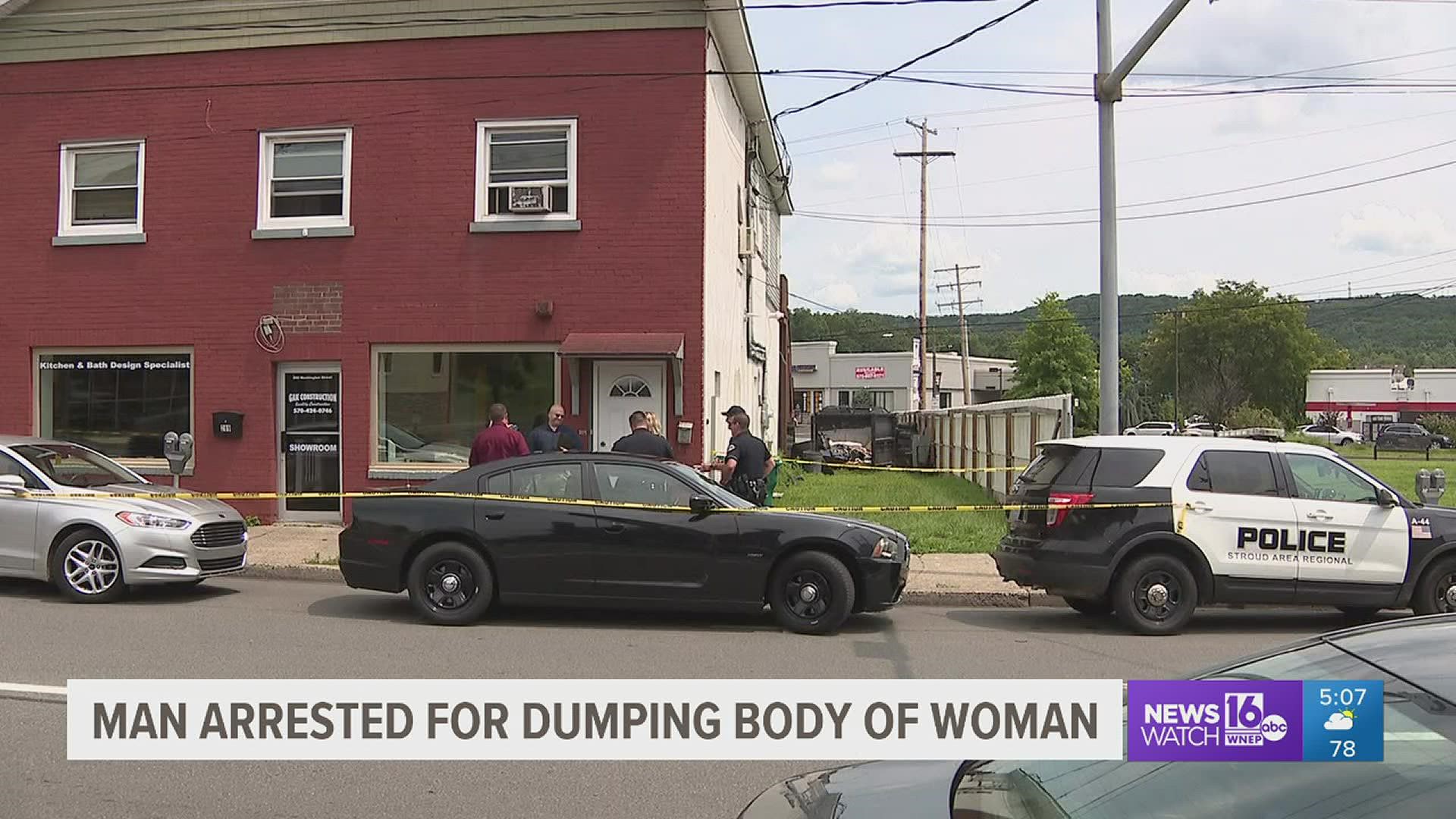 An arrest has been after police have charged a man with dumping a woman's body in a dumpster in Monroe County.