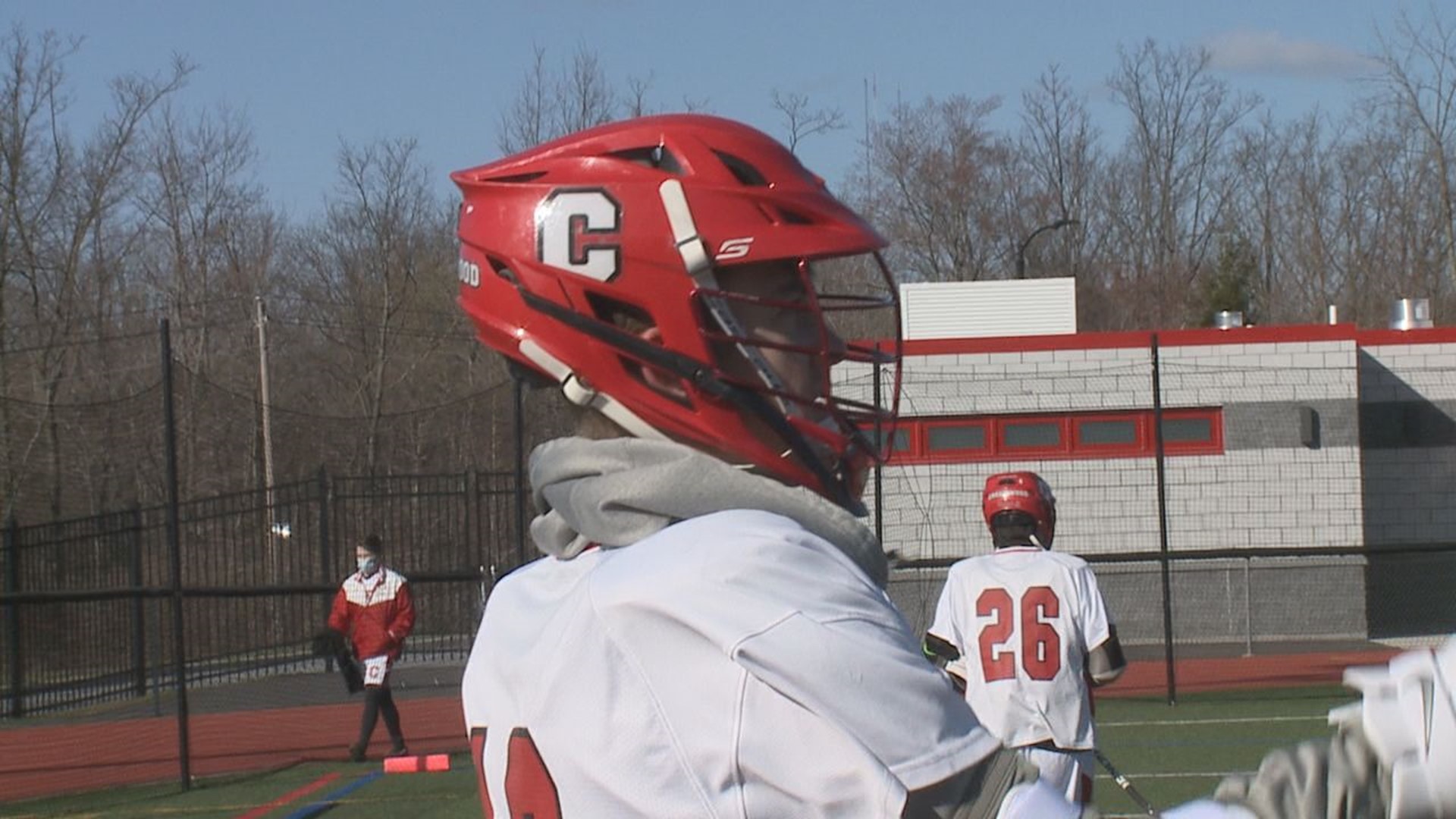 The Comets and the Tigers in boy's lacrosse action