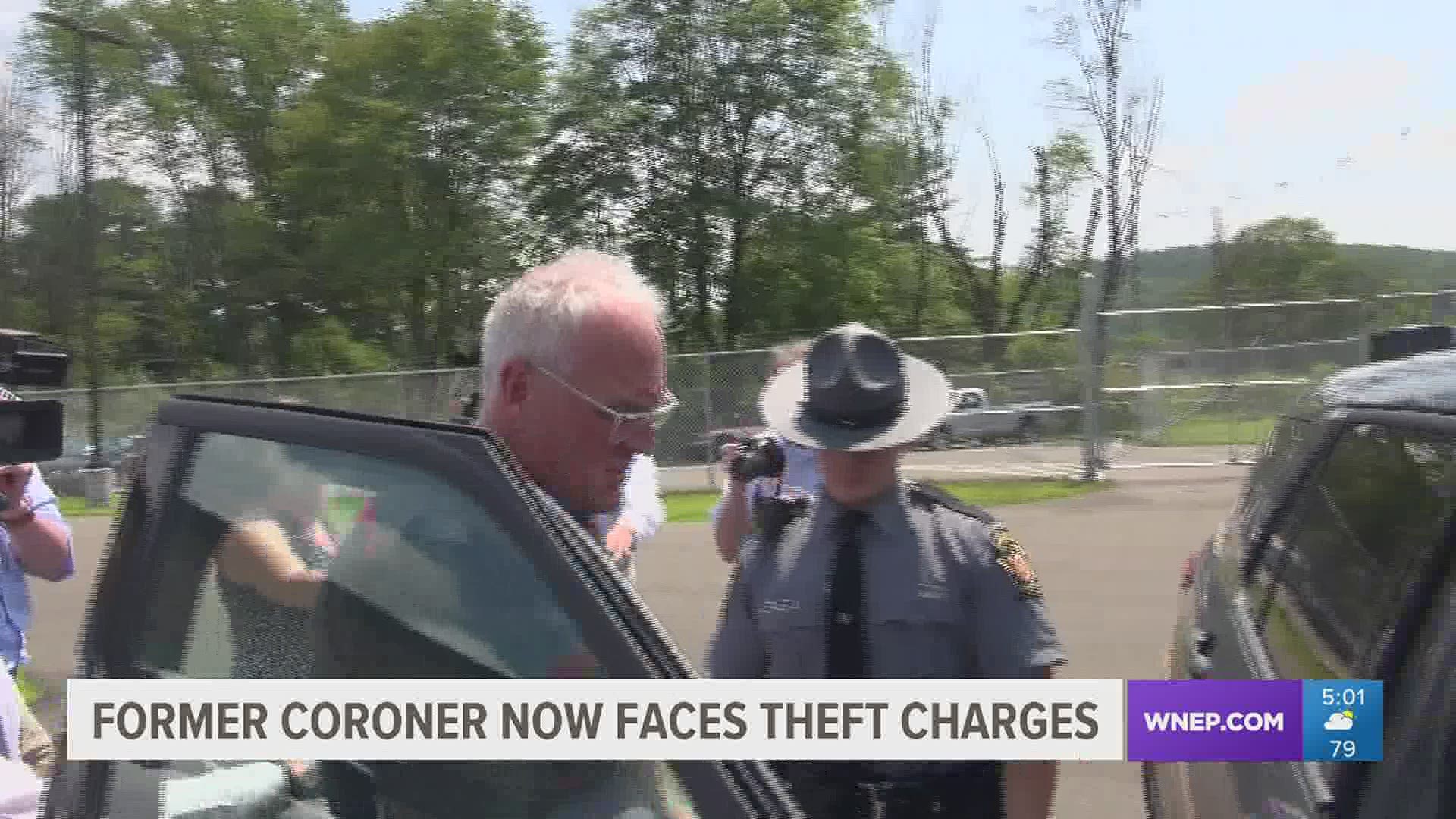 Tom Carman was led into the state police barracks in Towanda in handcuffs Wednesday morning.