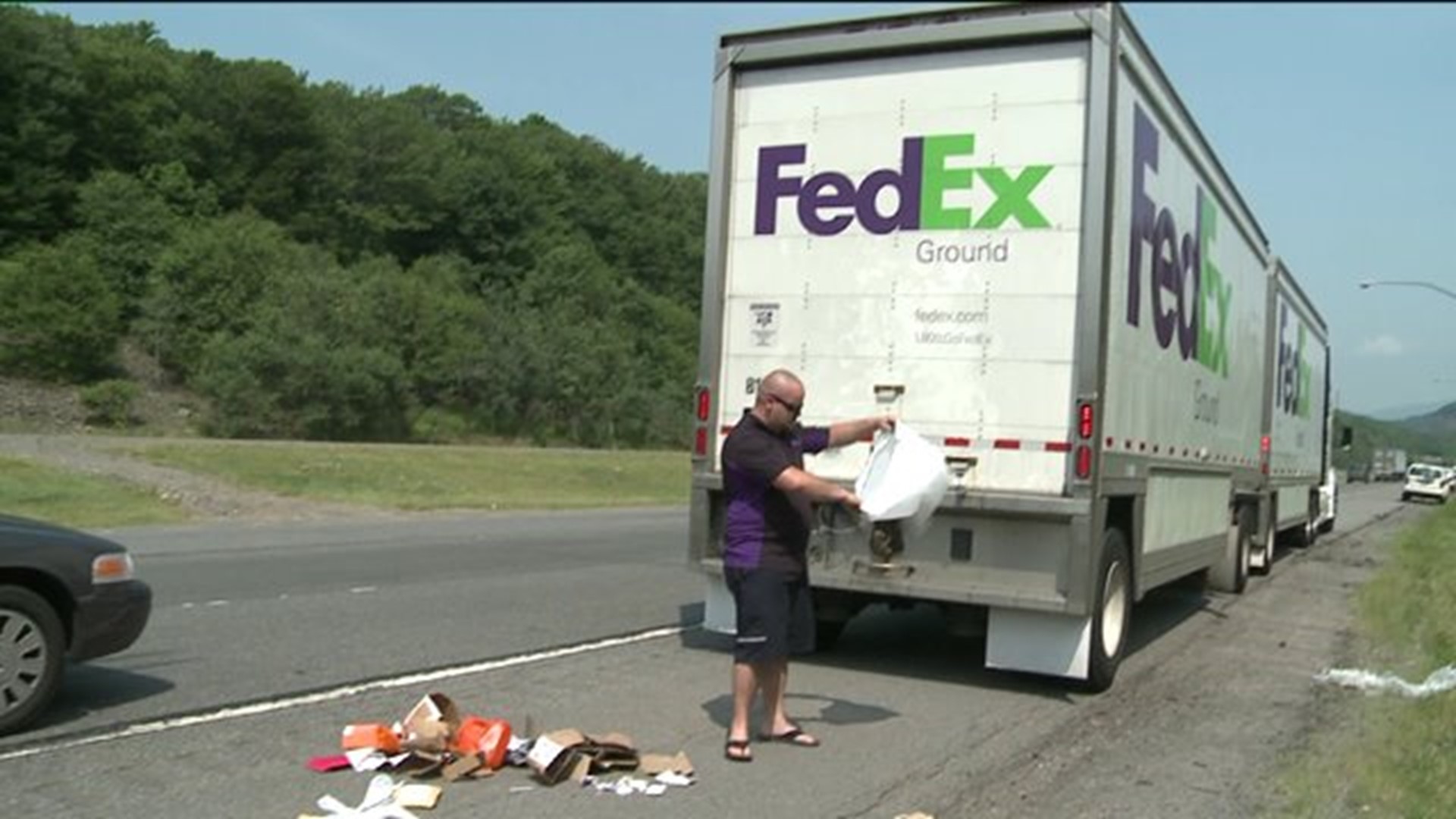 FedEx Truck Spills Packages on Interstate