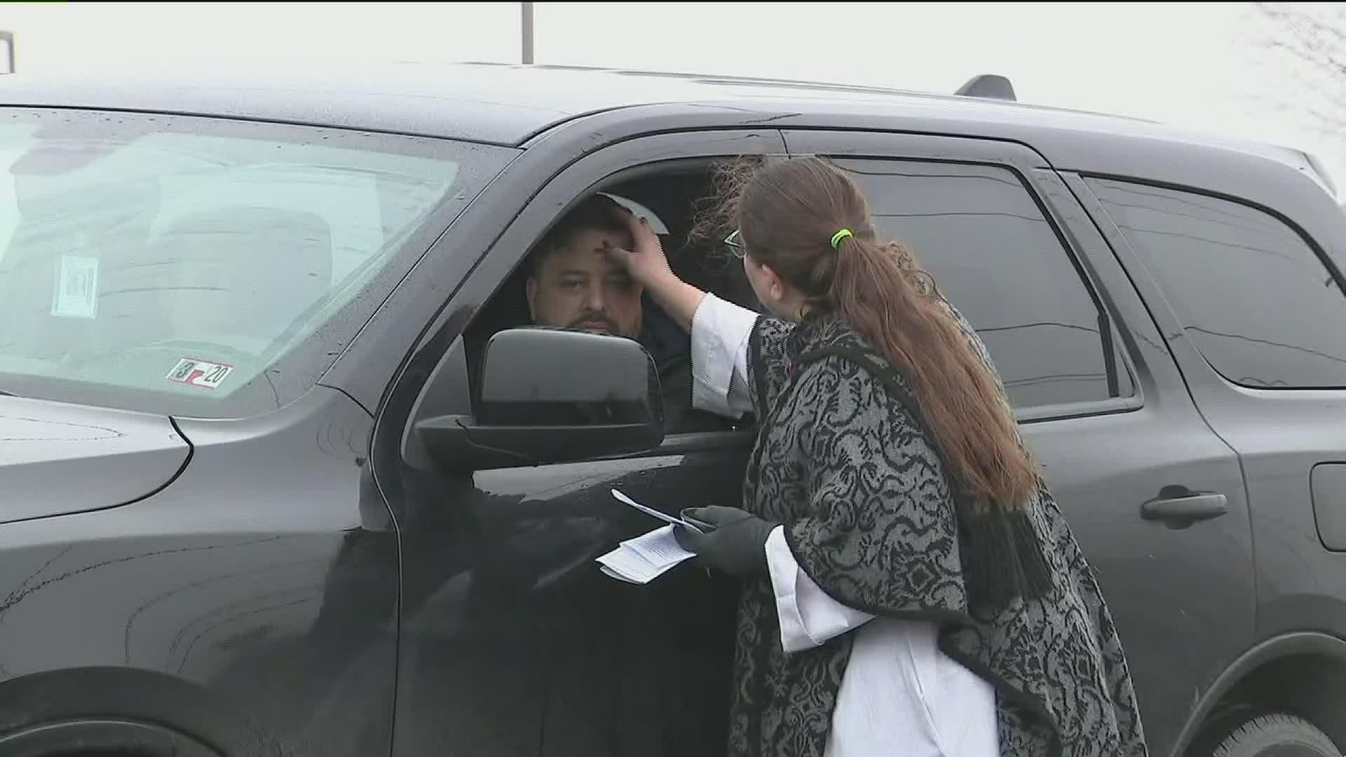 A pastor in Monroe County takes Ash Wednesday curbside for those who can't attend services.