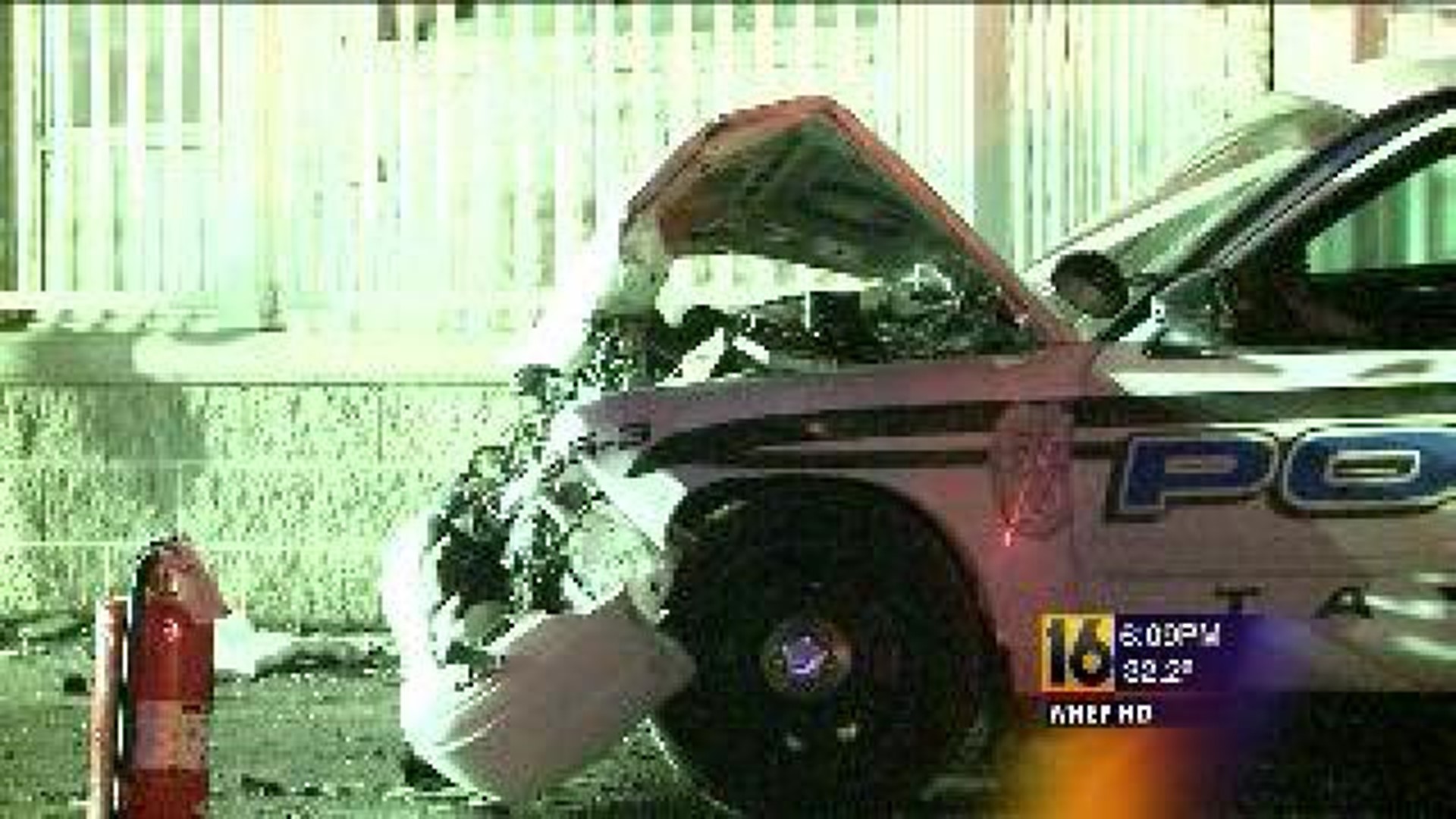 Police Cruiser and Car Collide