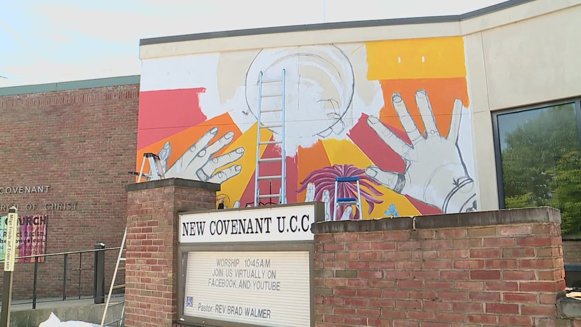 Lycoming College art students are painting a mural on the side of the New Covenant United Church of Christ in Williamsport.