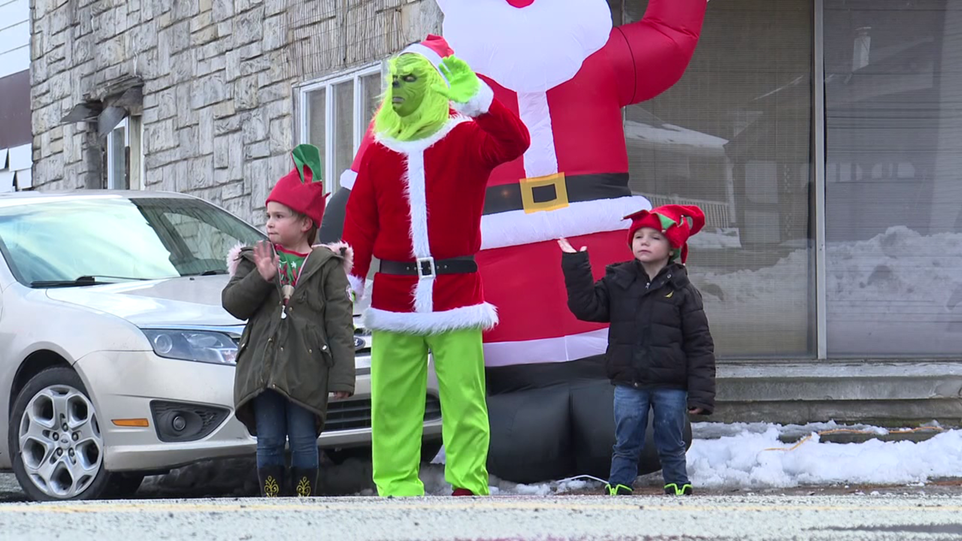 Grinch truck delivers holiday cheer and hope to the QCA