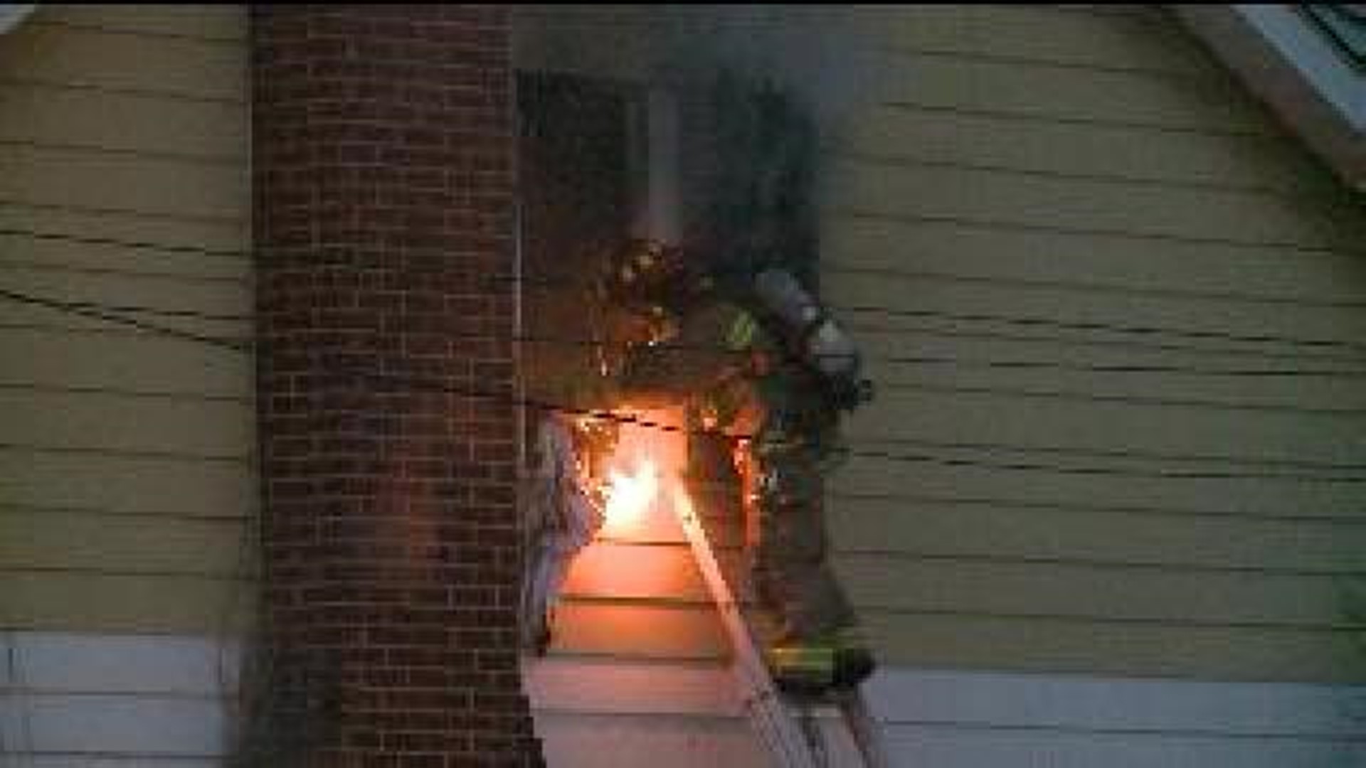 Mother Jumps from burning home