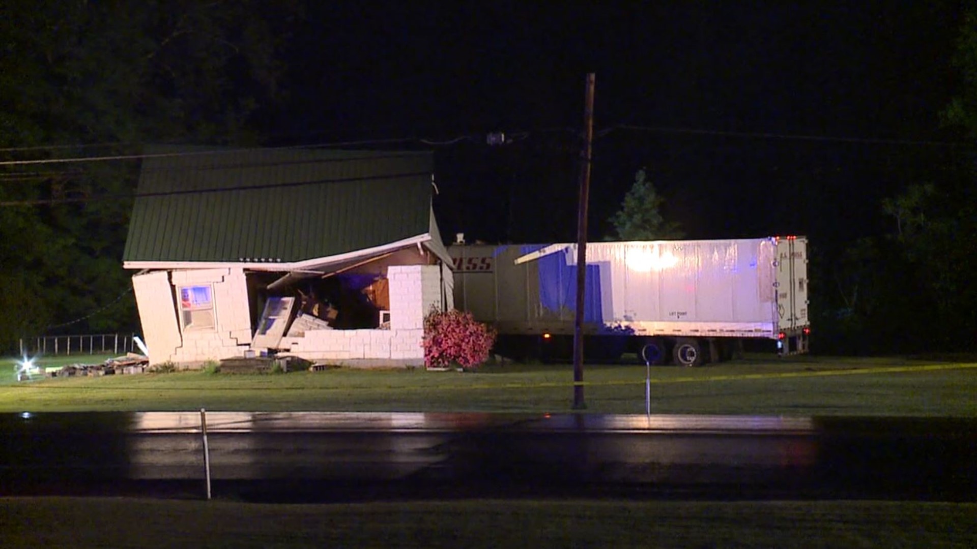 The tractor-trailer knocked the house off its foundation in Eaton Township.