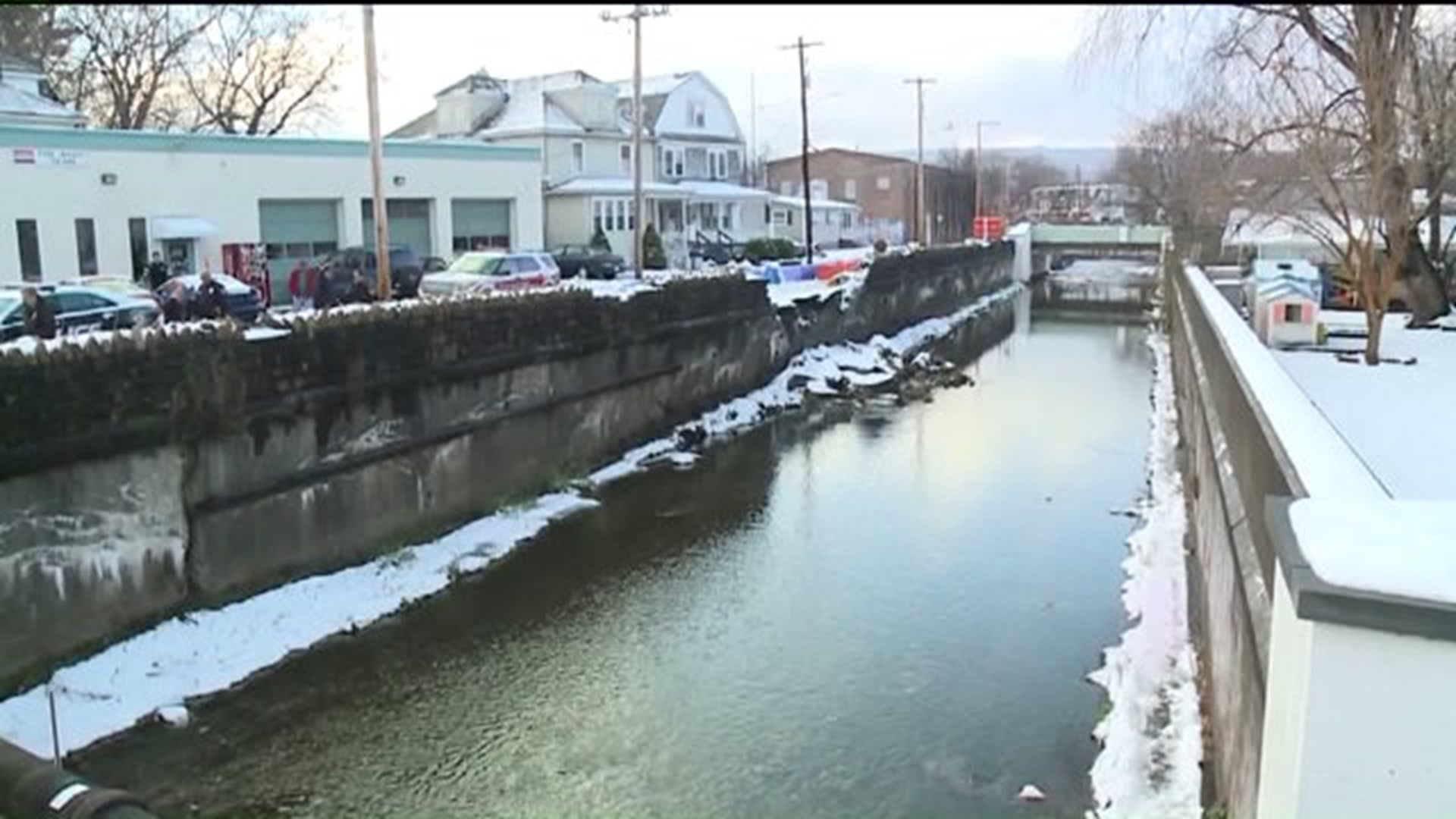 Sen. Casey Tours Crumbling Creek Wall in Wilkes-Barre, Promises Funding