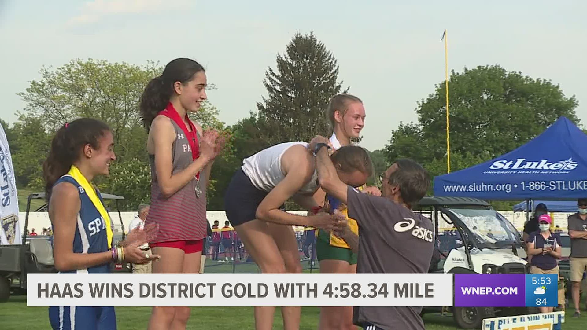 Blue Mountain Junior Olivia Haas won the 1600 in the District XI Track Championships and was given her gold medal by her Dad, Randy.