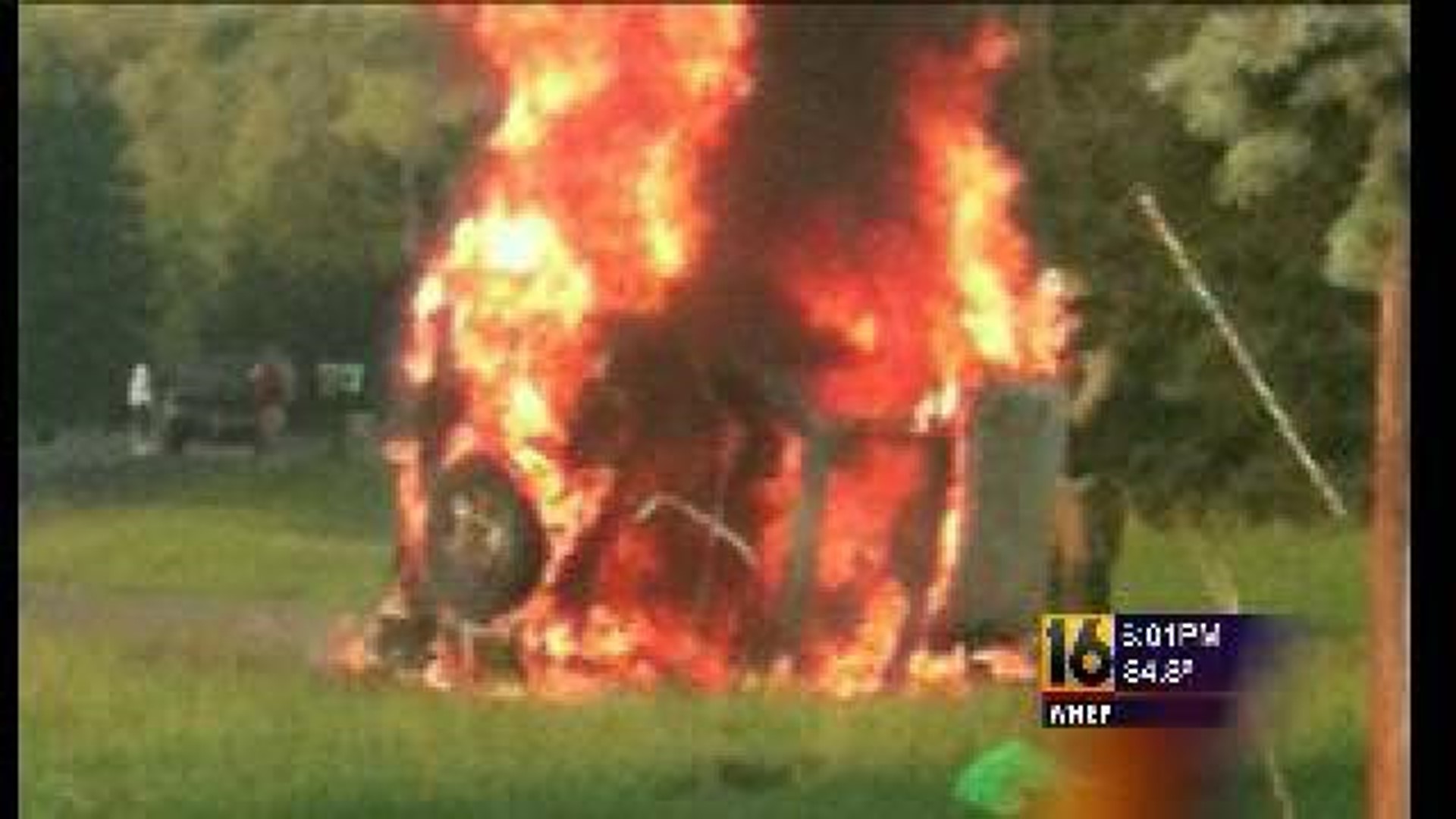 Two Men Pull Woman From Burning Car