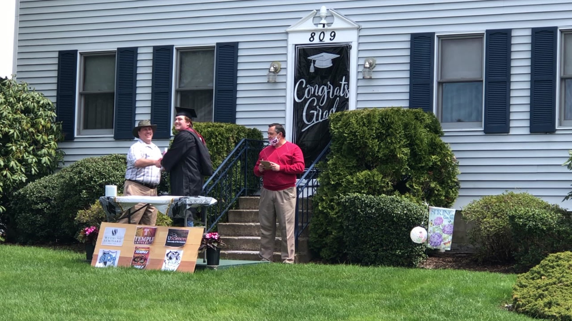 A makeshift graduation ceremony was held for three grads who missed their own because of the coronavirus.