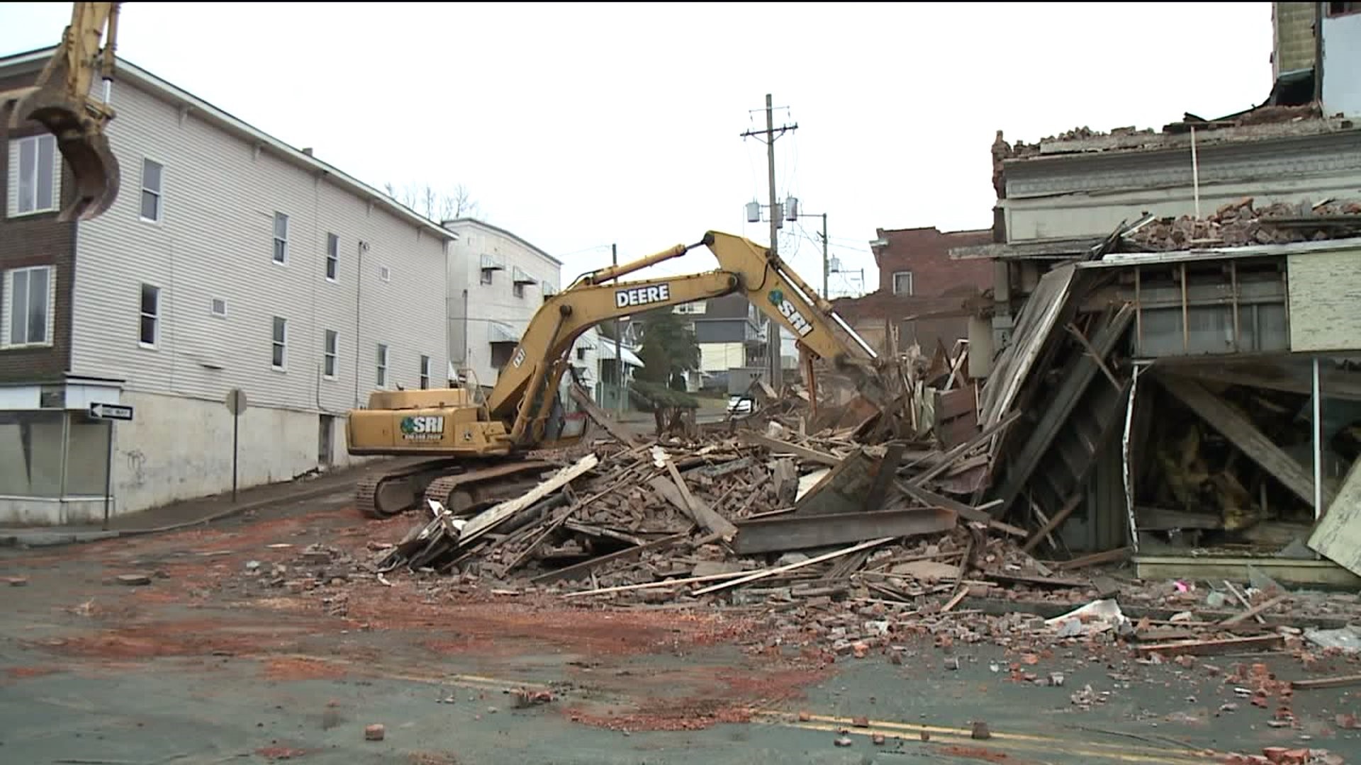 People stood and watched as buildings on Main Street in Nanticoke were demolished due to safety concerns