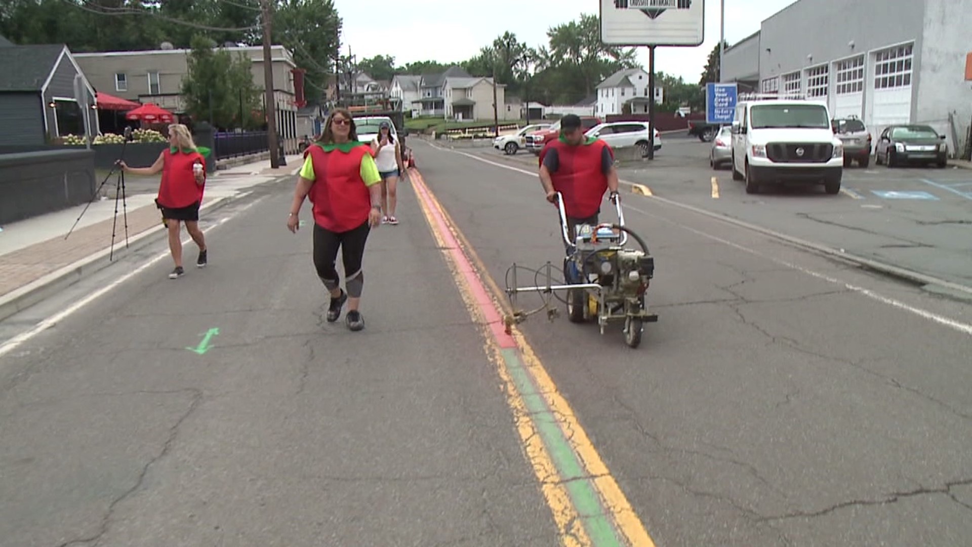 About 40 gallons of paint were used to paint the parade route red.