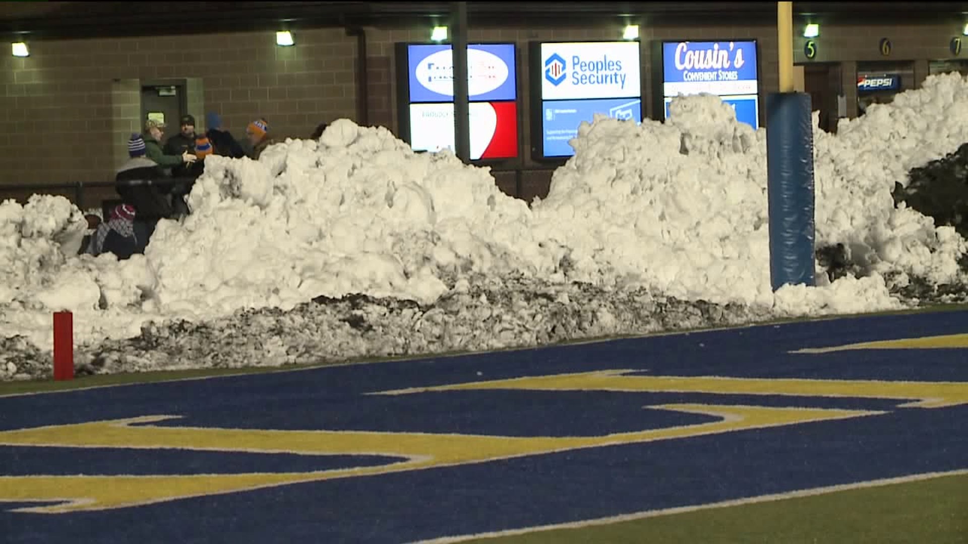 Clearing the Stadium of Snow for Championship Game