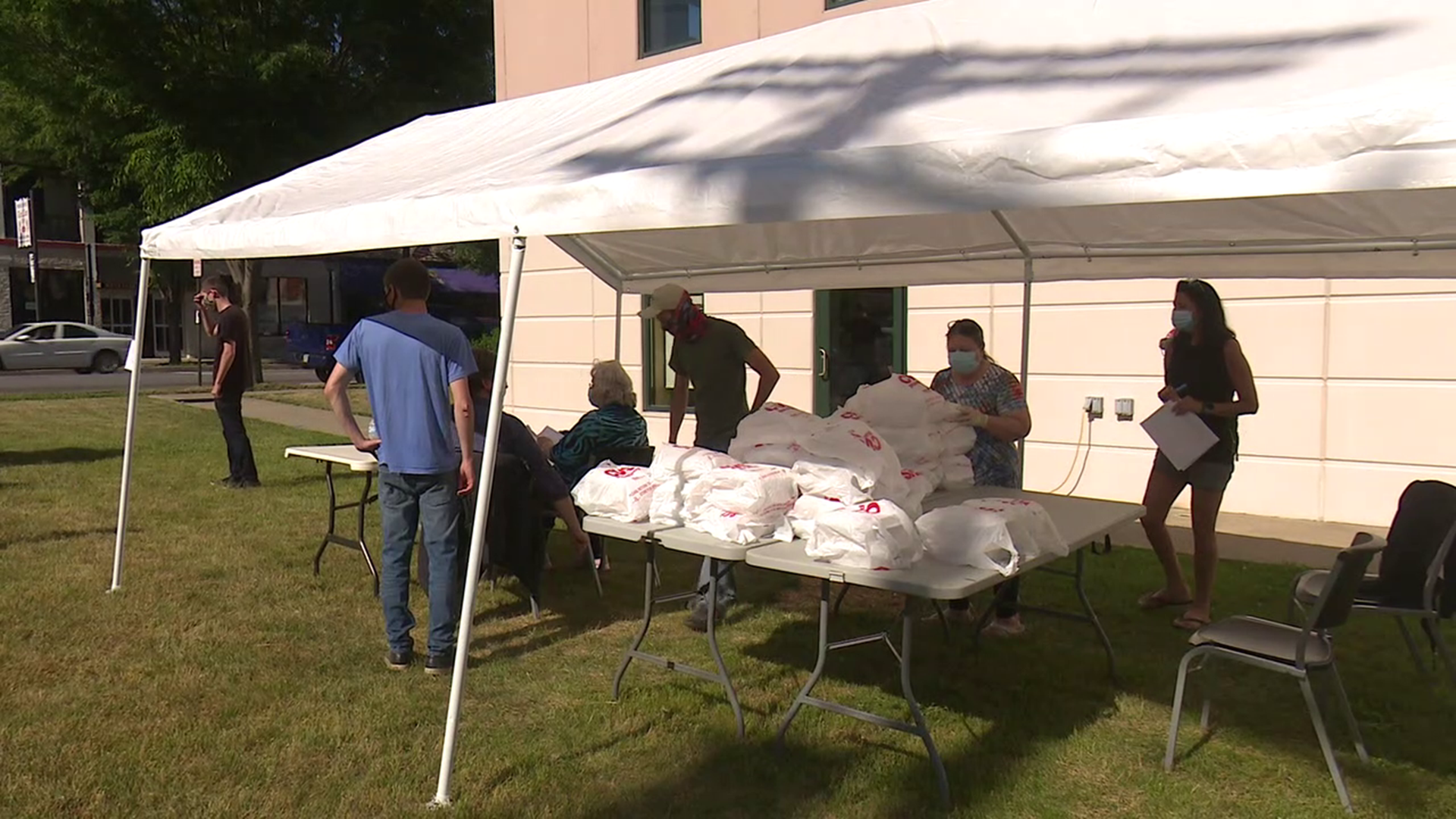 A tent was set up outside of the movie theater and inside about 20 volunteers were dishing up pasta dinners.