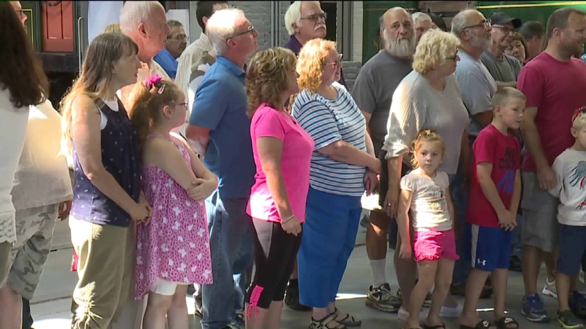 Crowds Line Up for Unveiling of Backyard Train