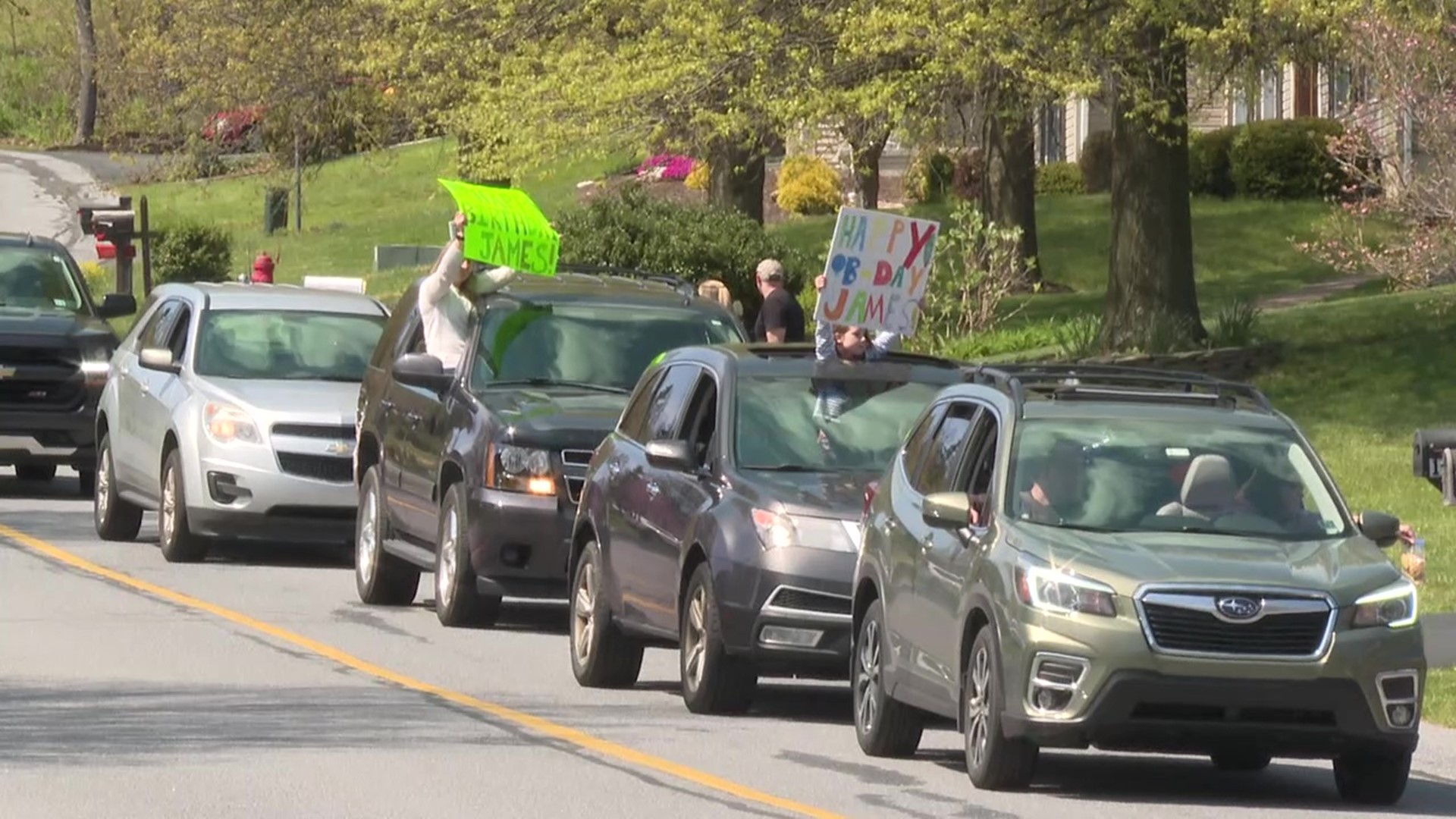 A birthday parade was held for a young boy who had lost his mother days ago in a car accident.