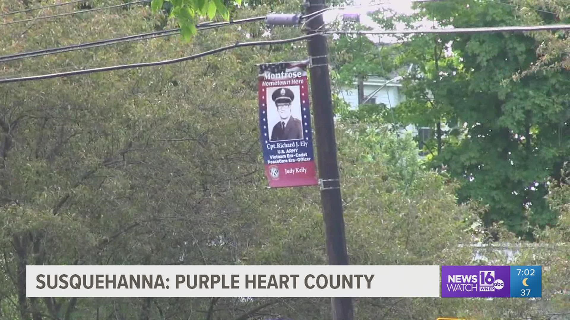 Signs are going up, designating the county as a Purple Heart community.