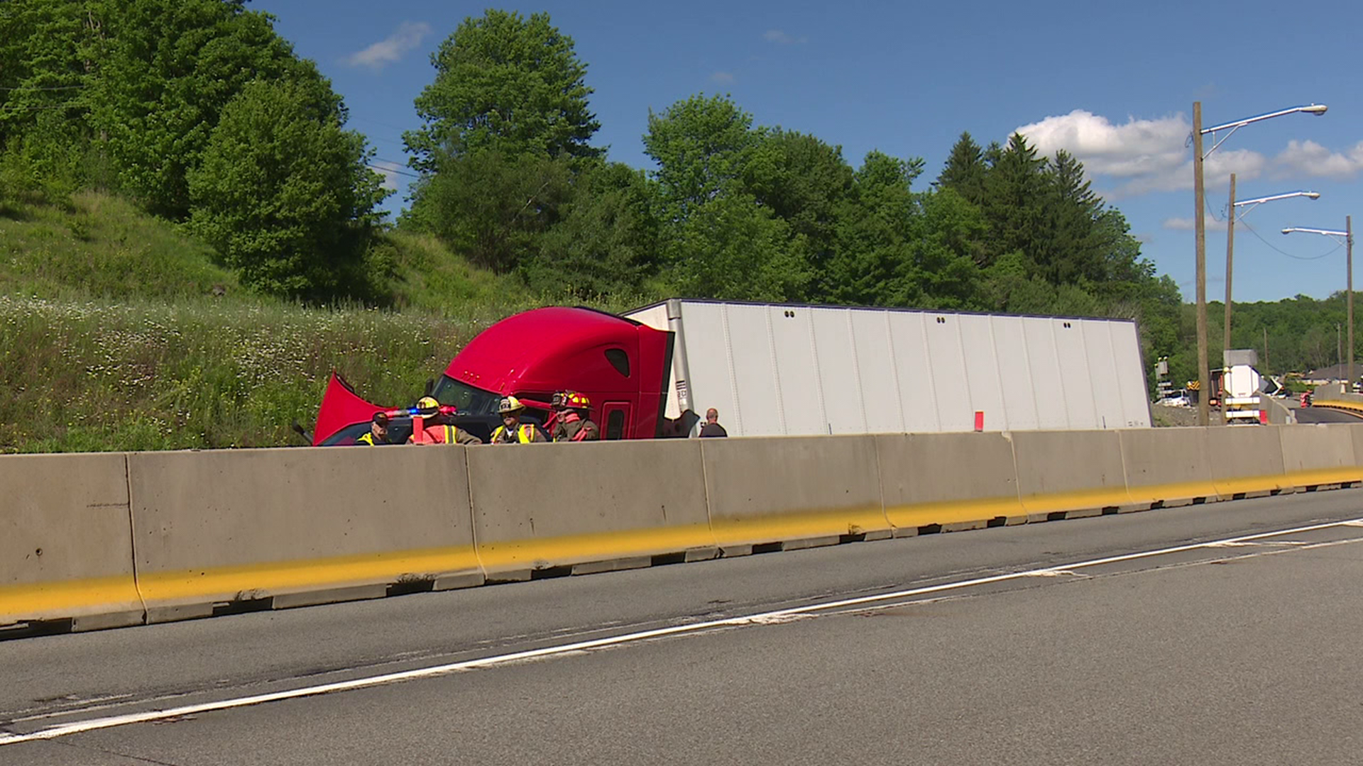 One tractor-trailer flipped over onto its side.