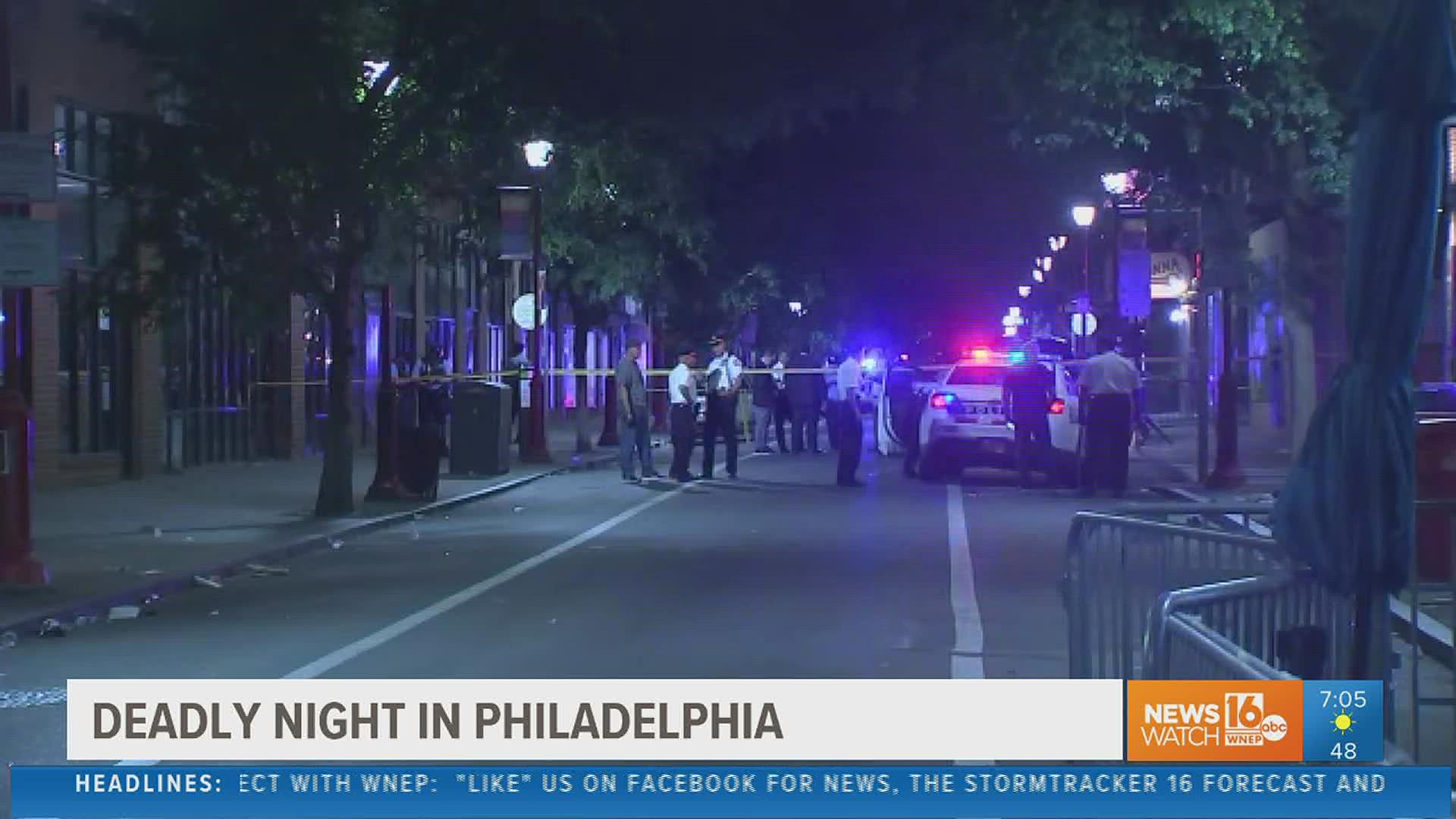 Authorities say gunfire killed three people and wounded at least 11 others in one of Philadelphia's most popular entertainment districts late Saturday night.