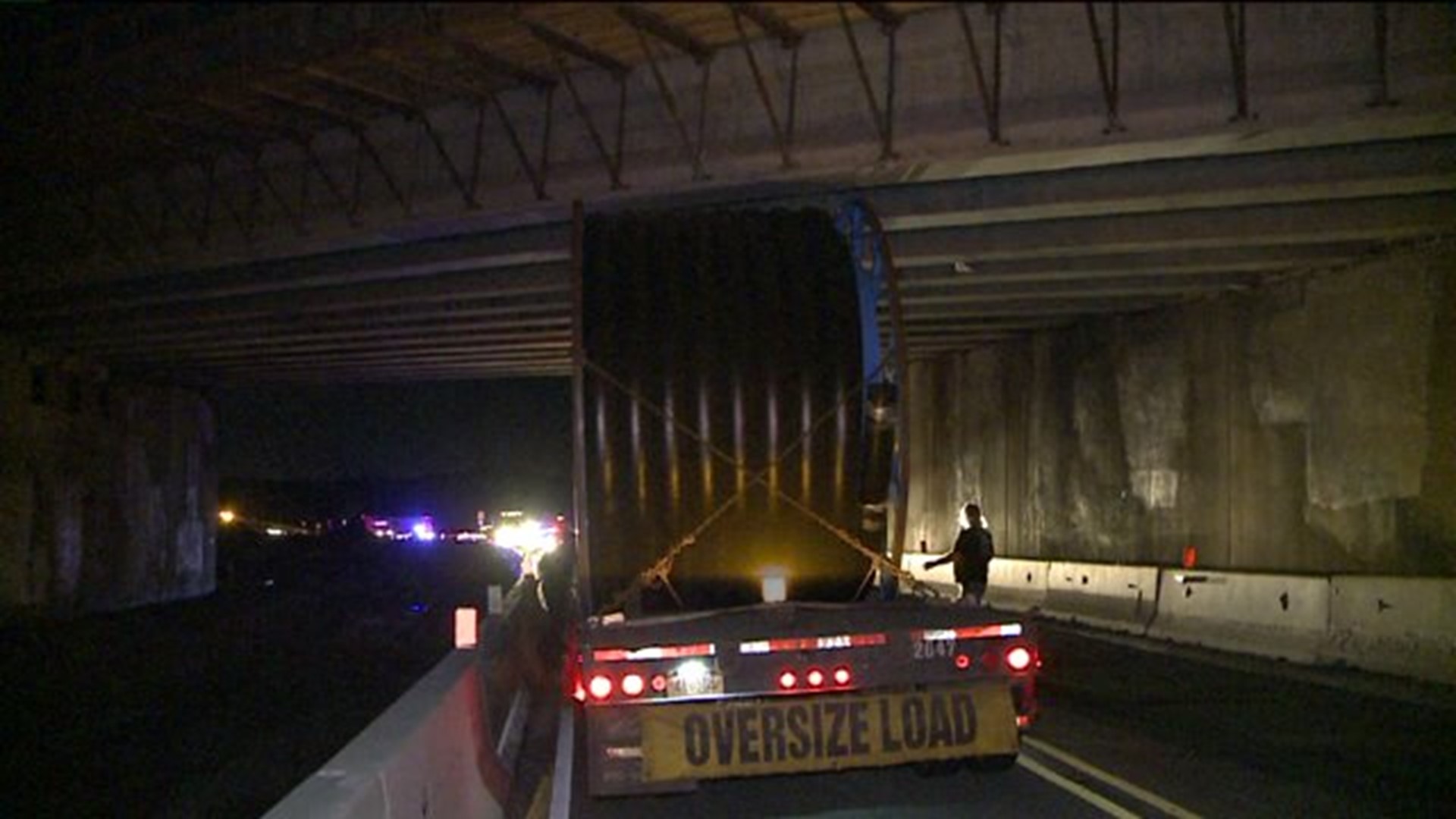 Crews Remove Stuck Truck from Under Bridge