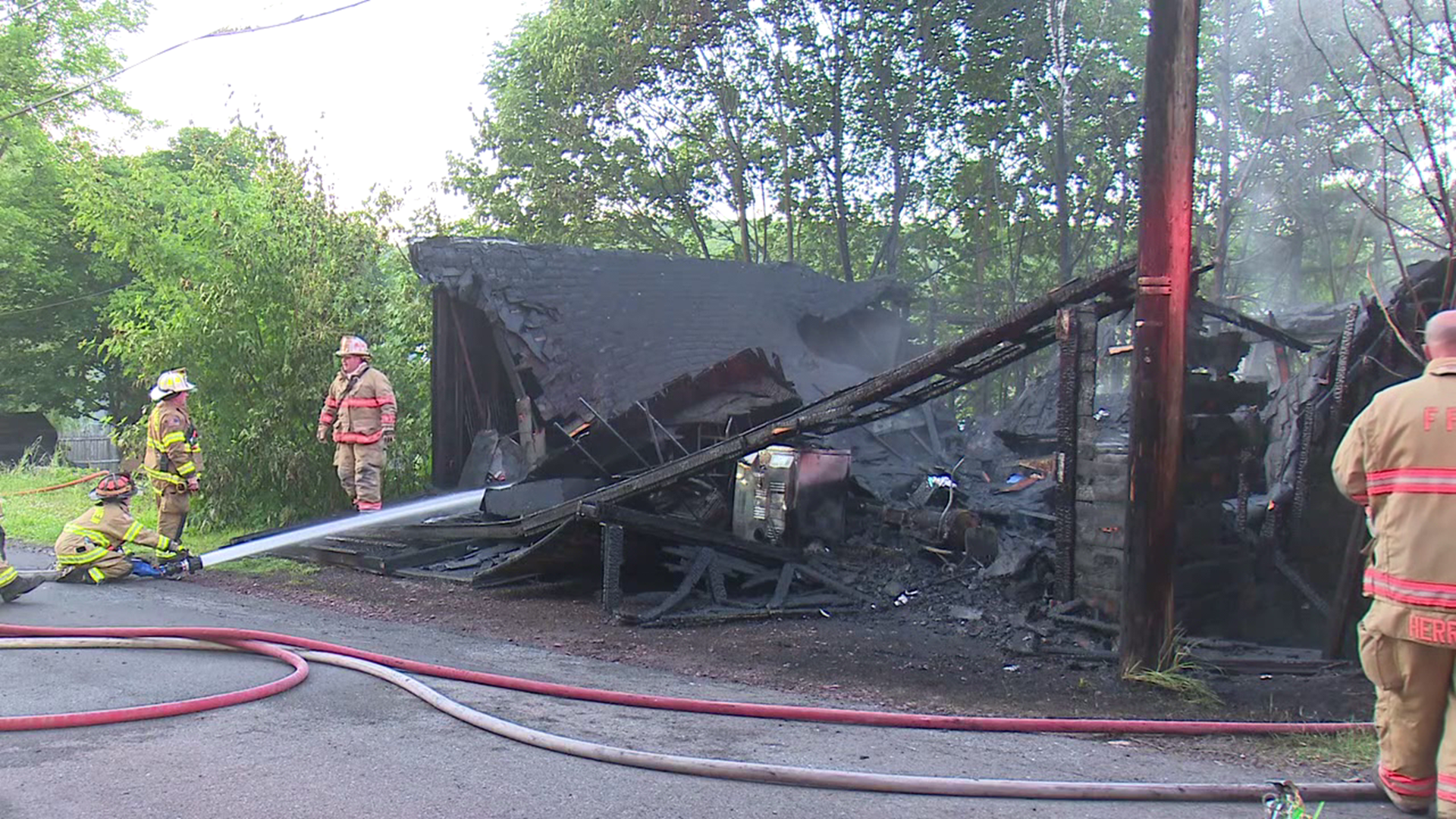 Two nearby homes were also damaged; the heat from the fire melted siding on both buildings.